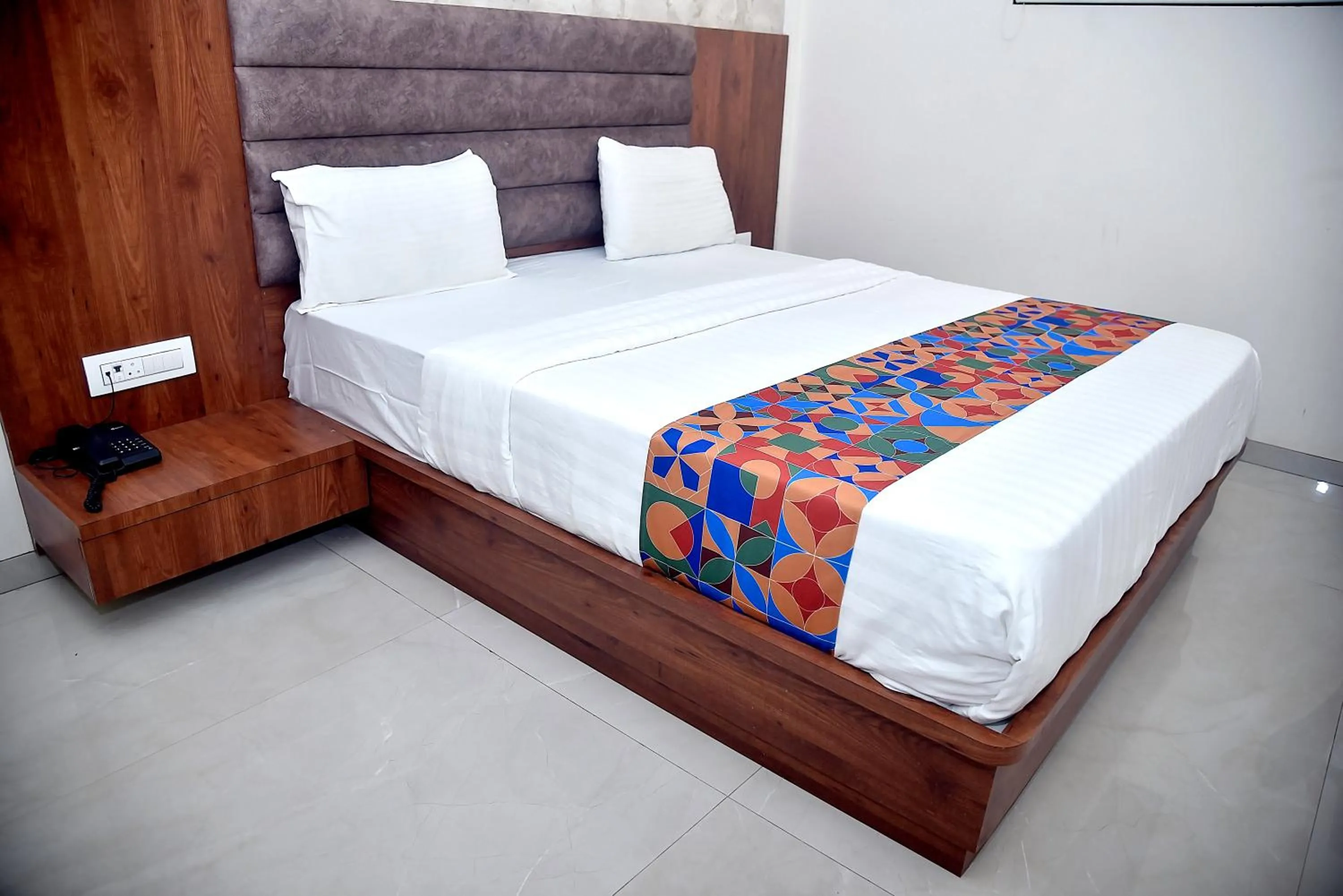 Bed in Hotel Pride Inn