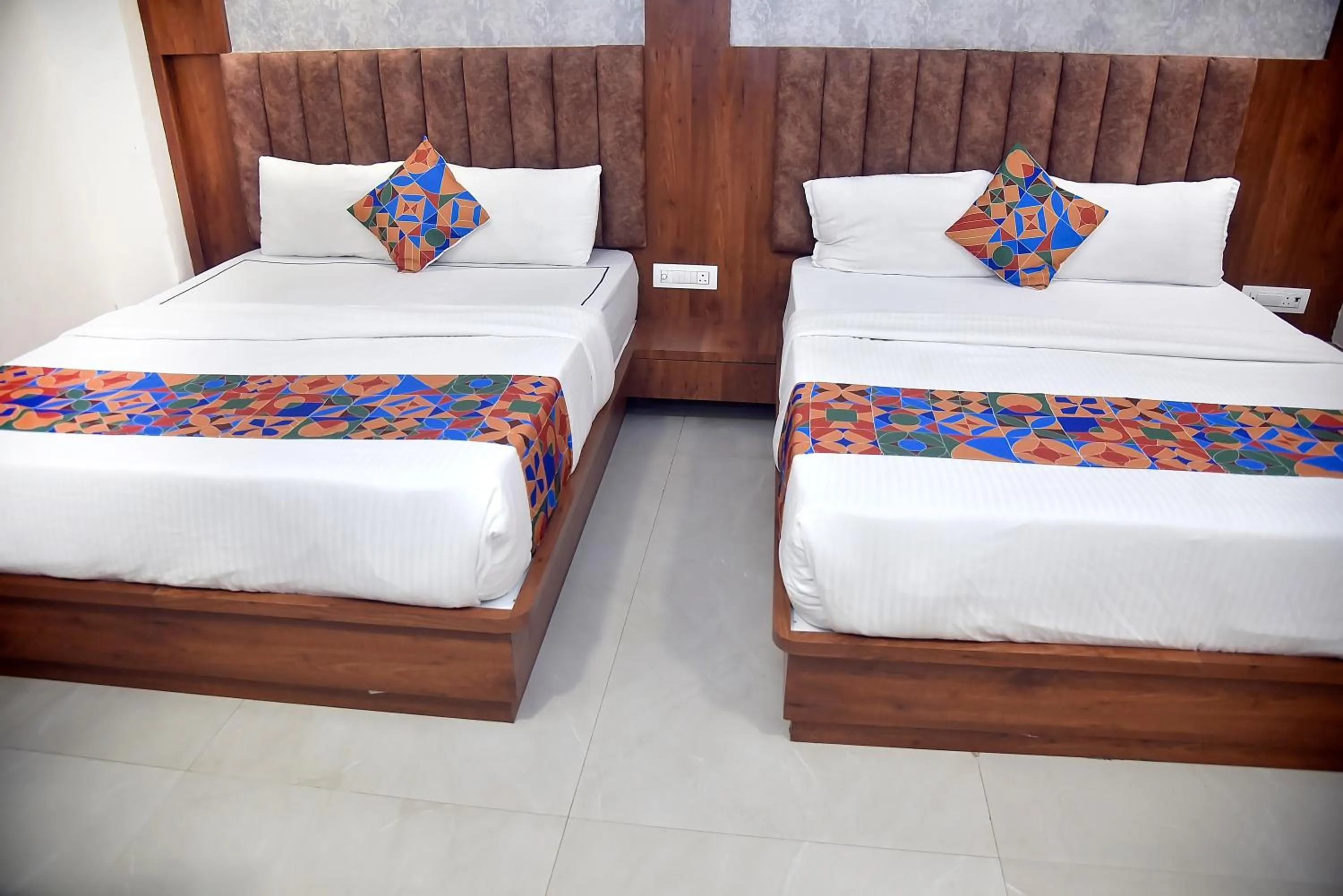 Bed in Hotel Pride Inn