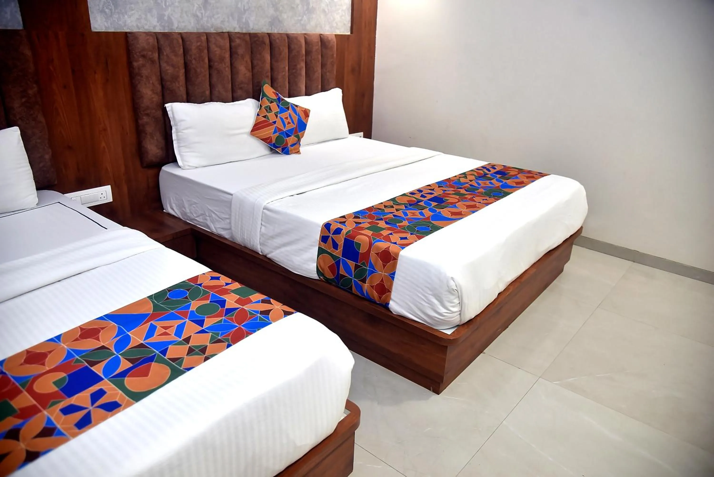 Bed in Hotel Pride Inn