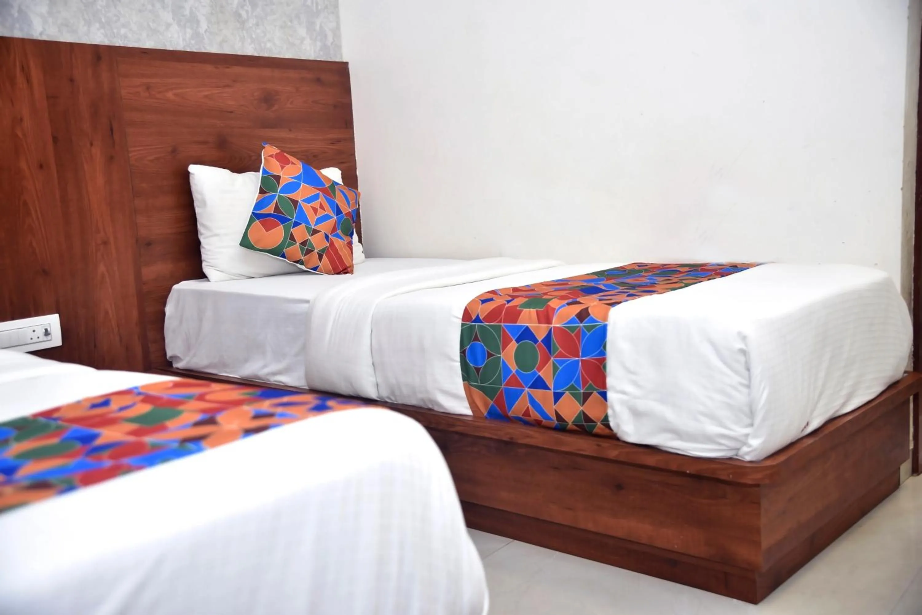 Bed in Hotel Pride Inn