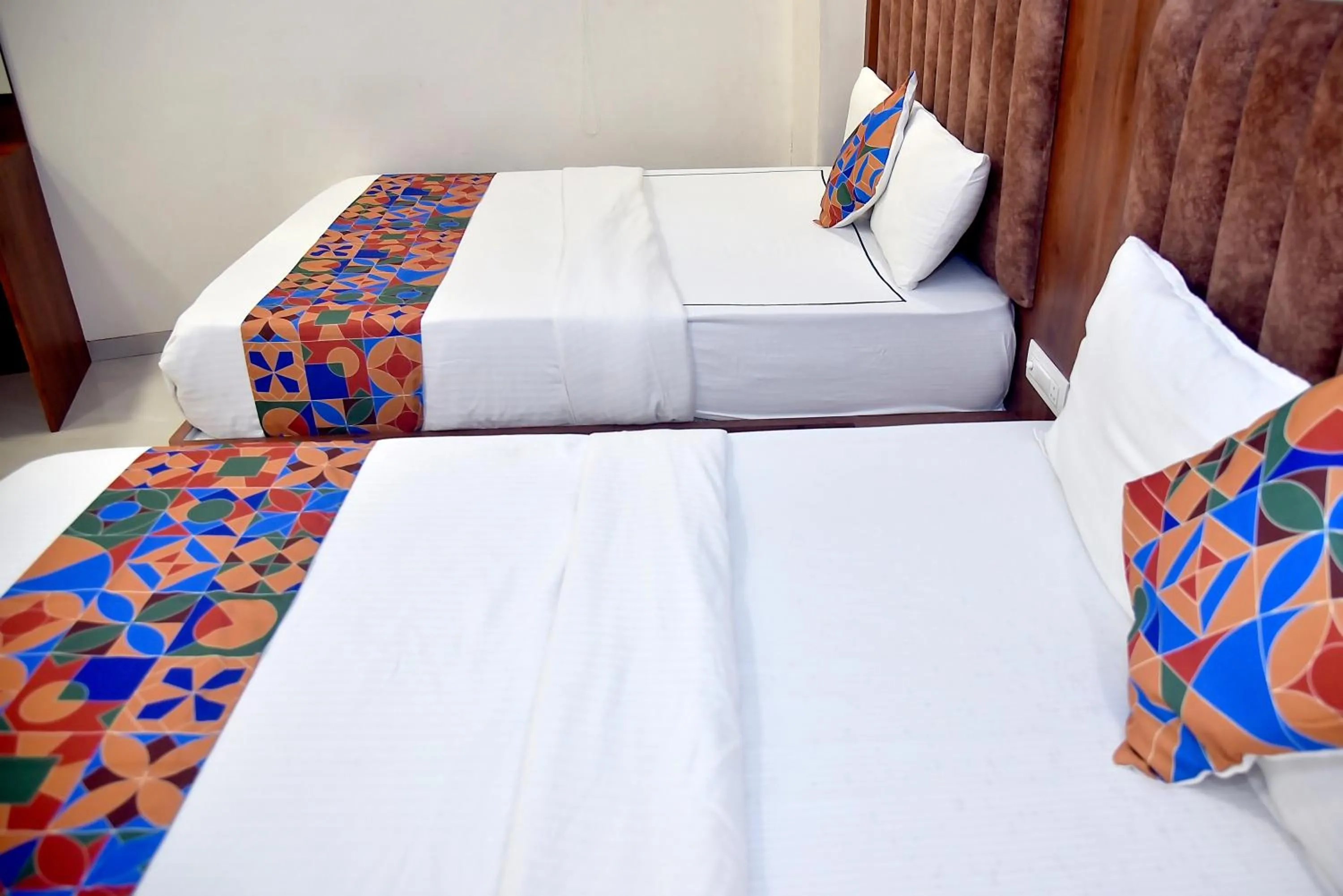 Bed in Hotel Pride Inn