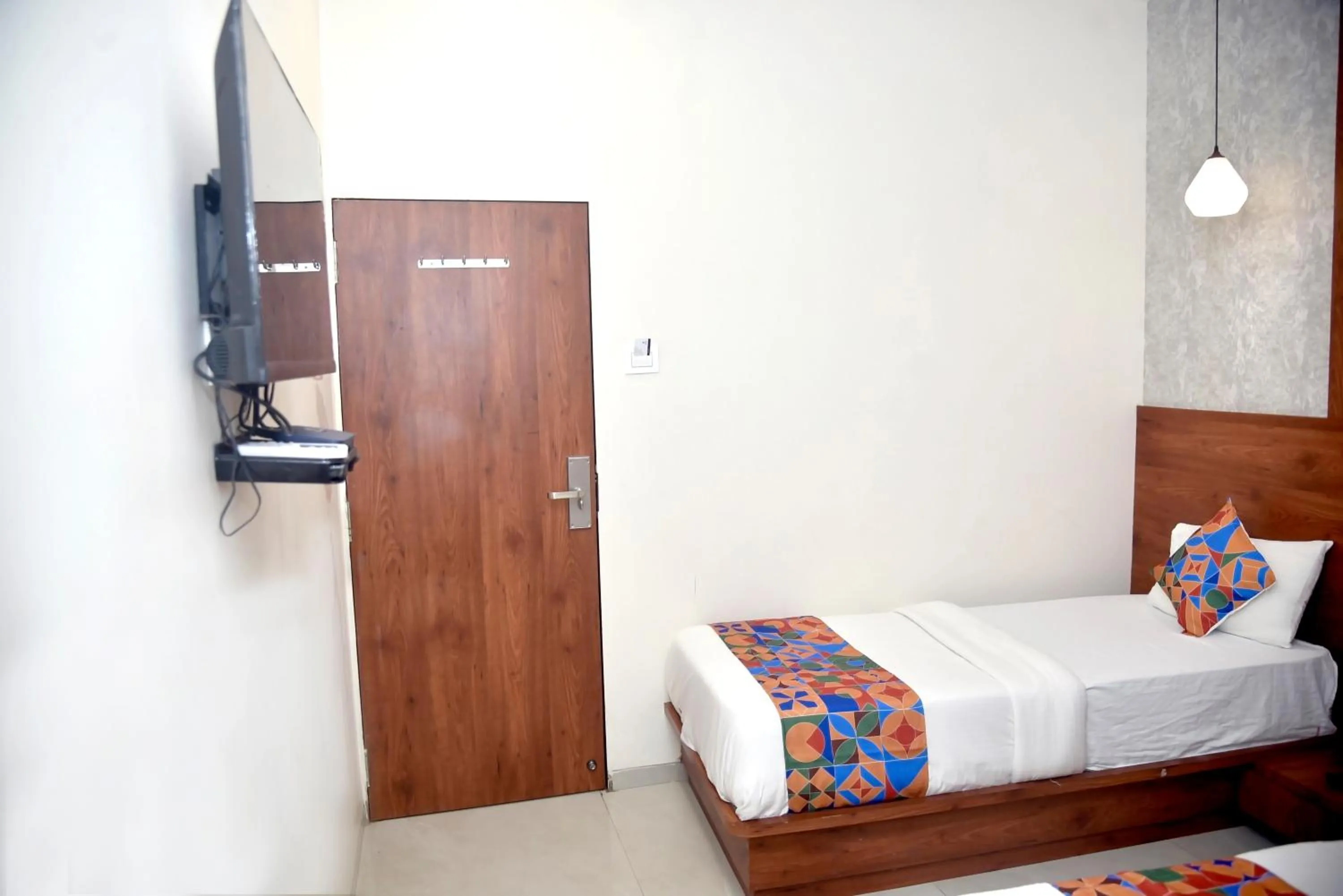 Bed in Hotel Pride Inn