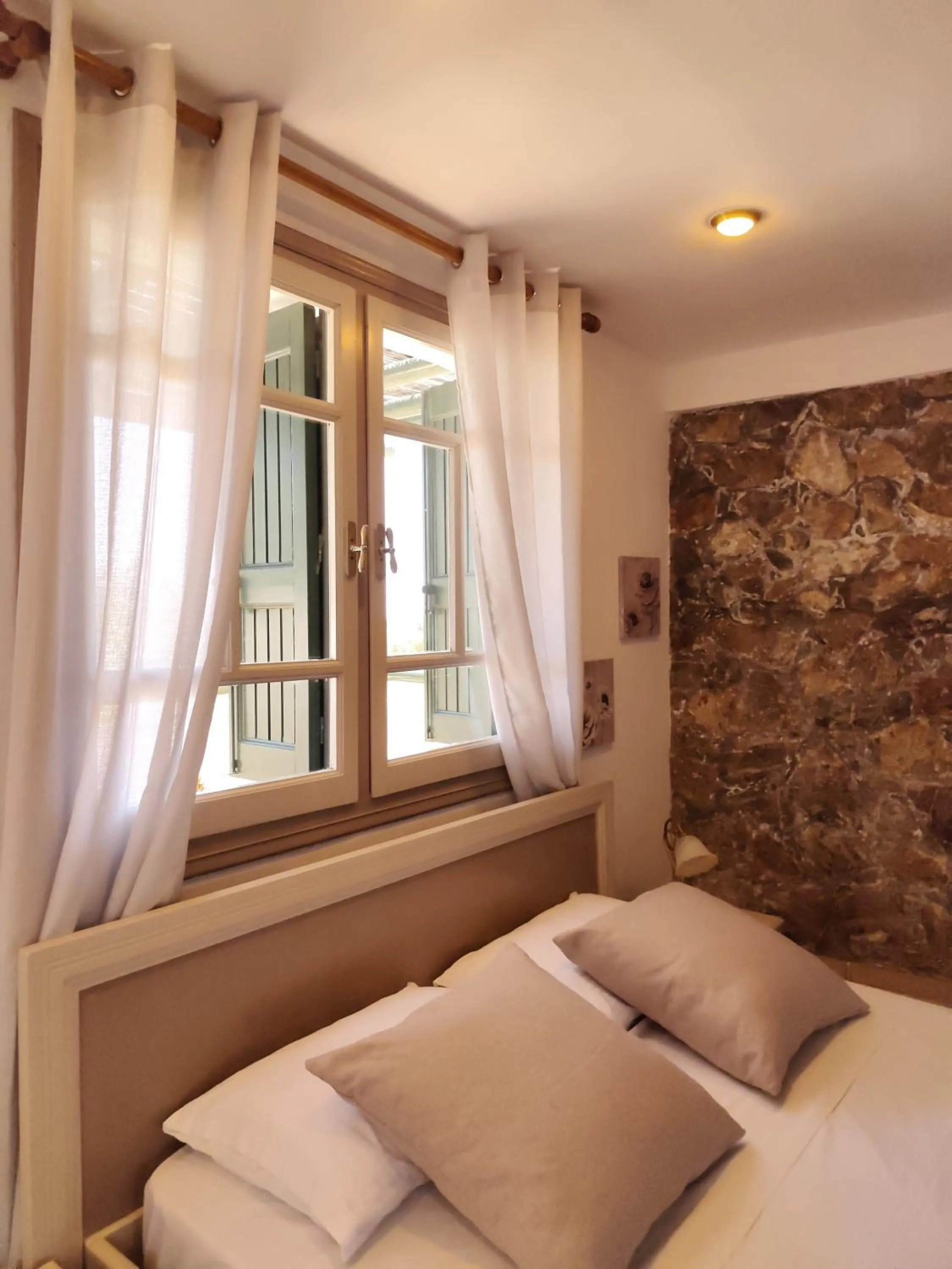 Bed in Elia Village by Irida Iris Group