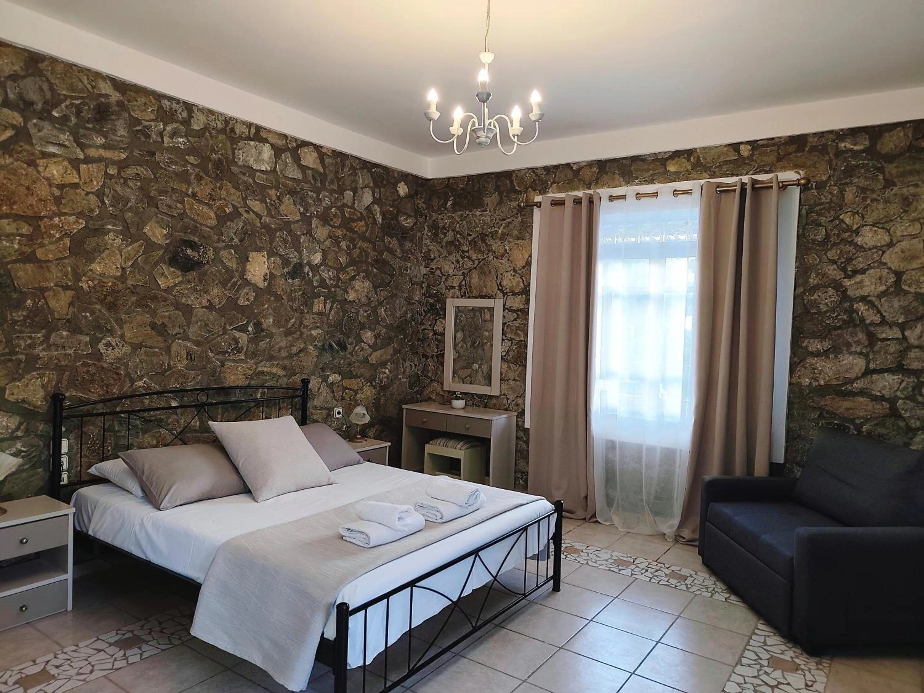 Bed in Elia Village by Irida Iris Group