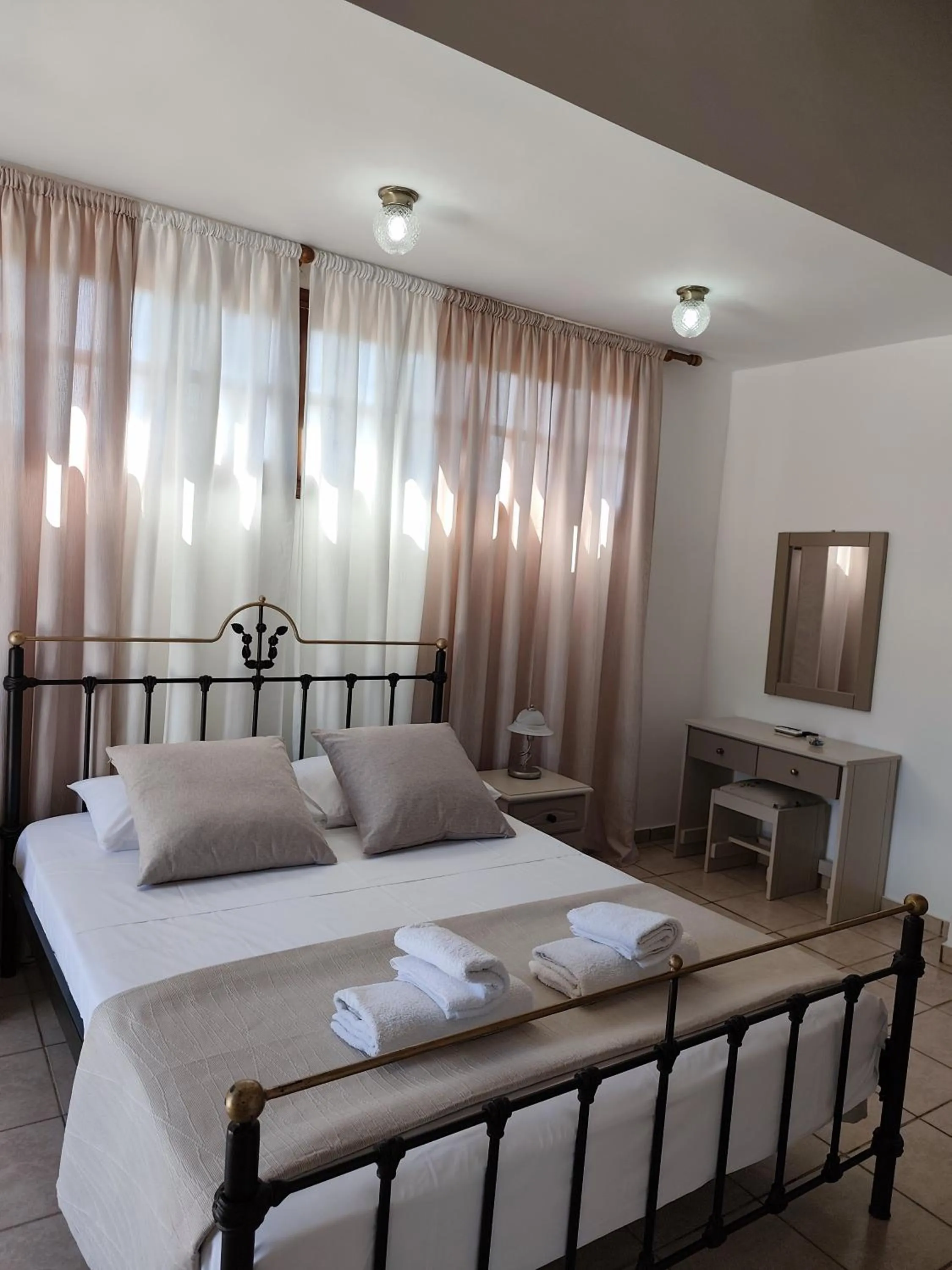 Bed in Elia Village by Irida Iris Group