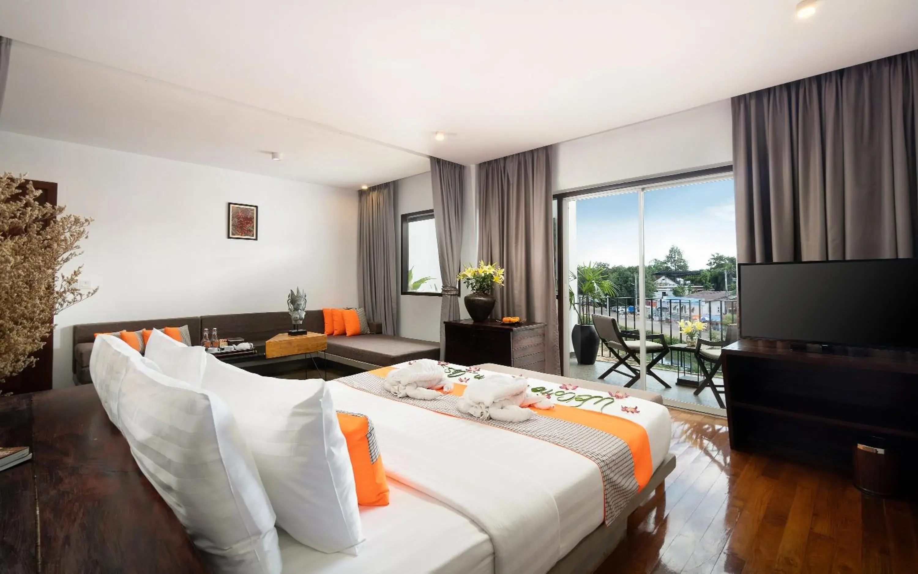 Junior King Suite City View with Balcony, Sofa Area, and Bathtub in The Calm Oasis Junior King Suite City View with Balcony, Sofa Area, and Bathtub in The Calm Oasis