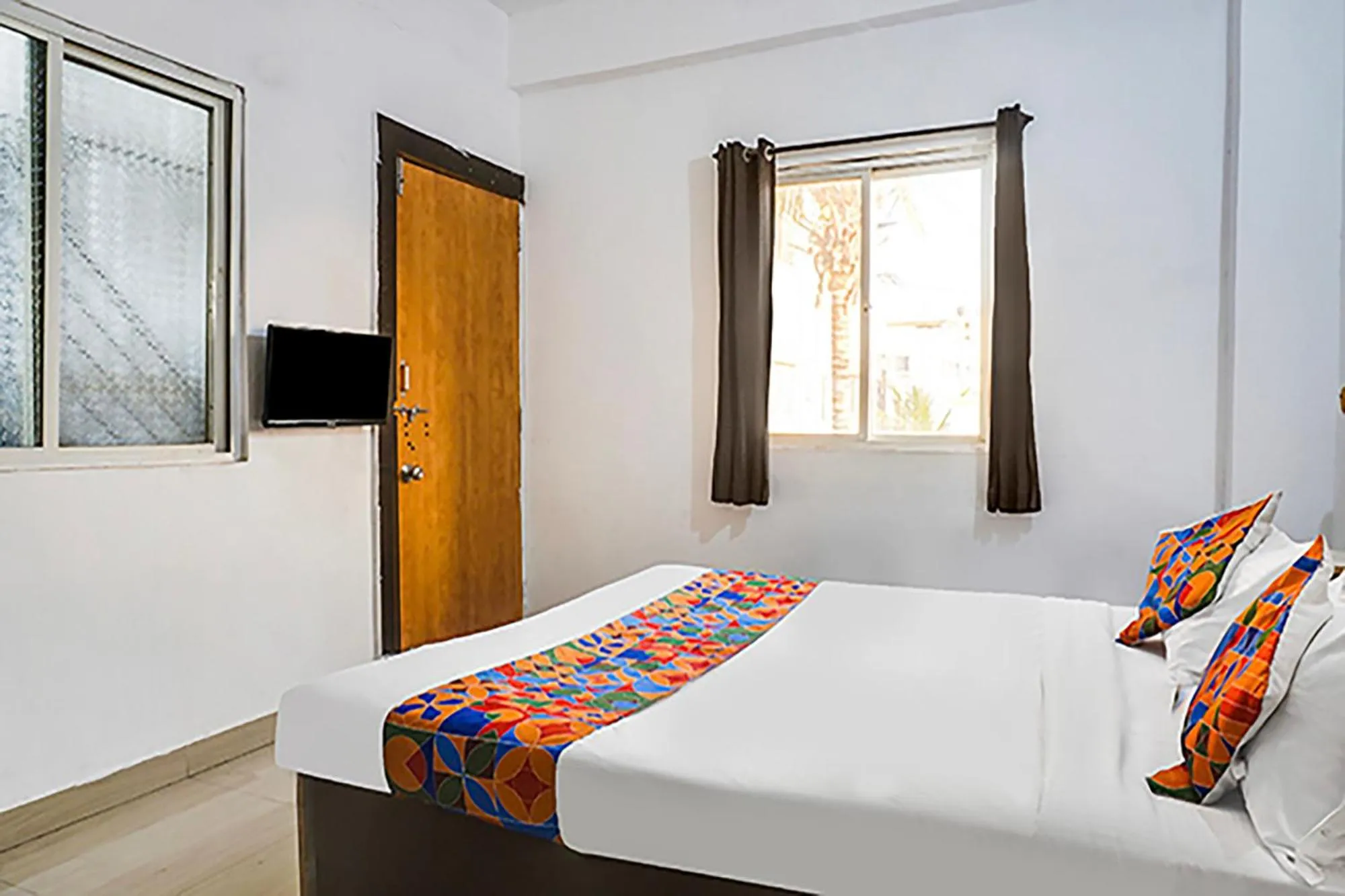 Bed in FabHotel Galaxy Airport Inn, Airport Road