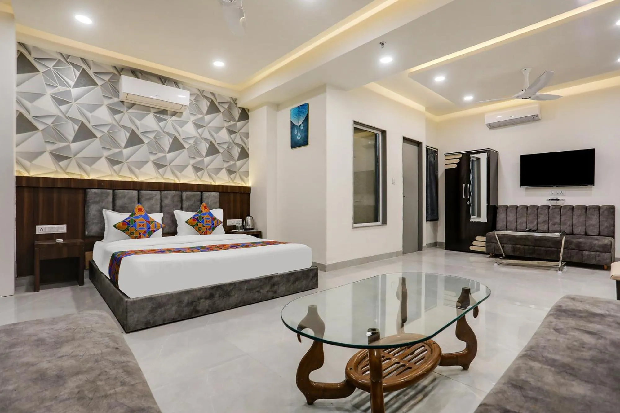 Bed in FabHotel Prime Panchwati Regency