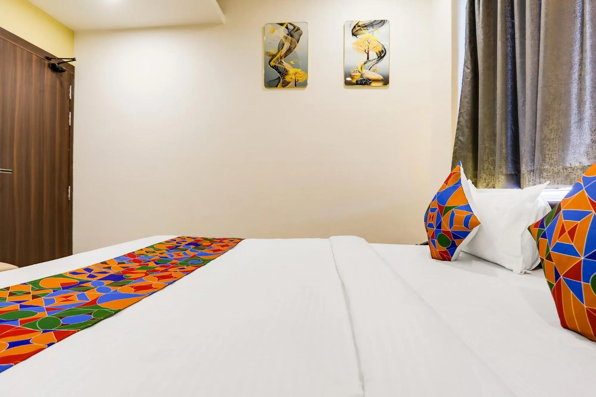 Bed in FabHotel Prime Panchwati Regency