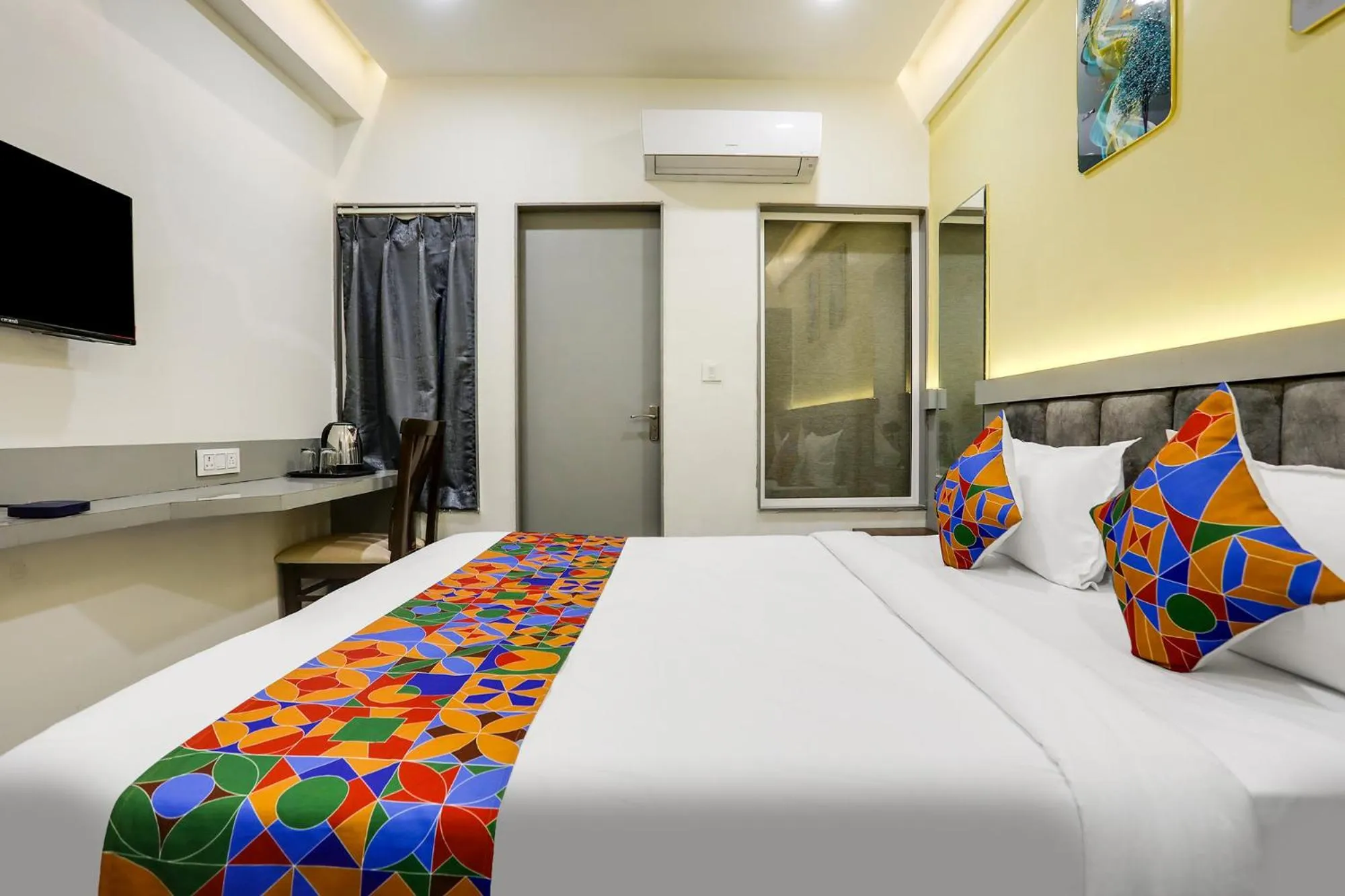 Bed in FabHotel Prime Panchwati Regency