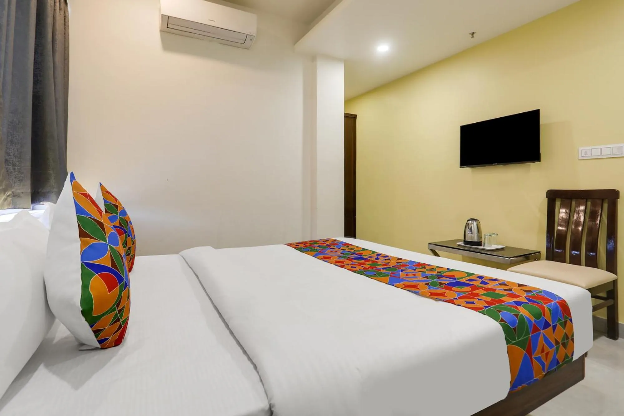 Bed in FabHotel Prime Panchwati Regency