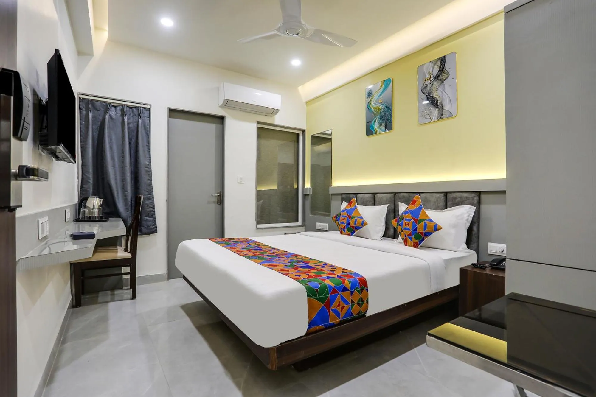 Bed in FabHotel Prime Panchwati Regency
