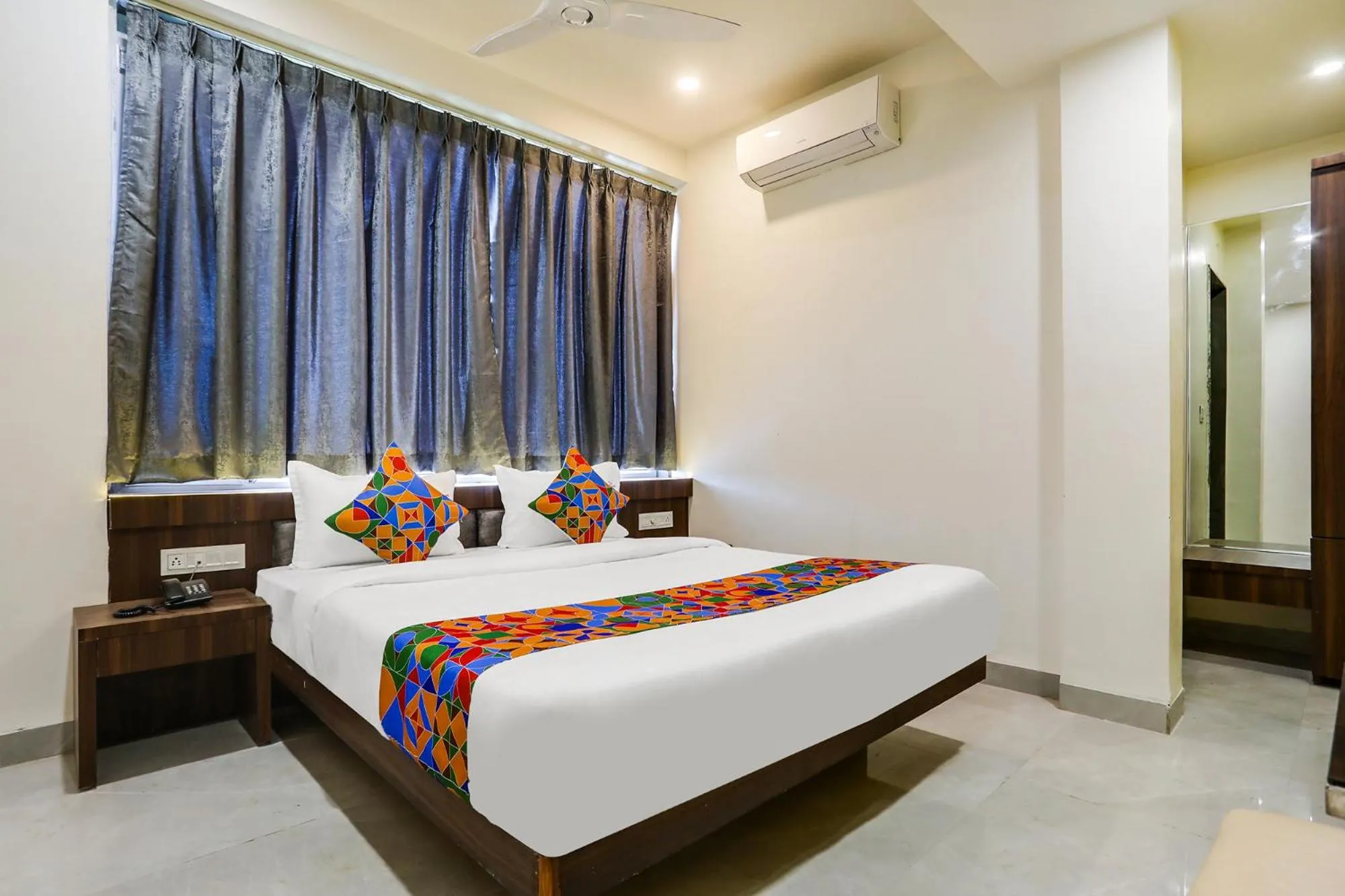 Bed in FabHotel Prime Panchwati Regency