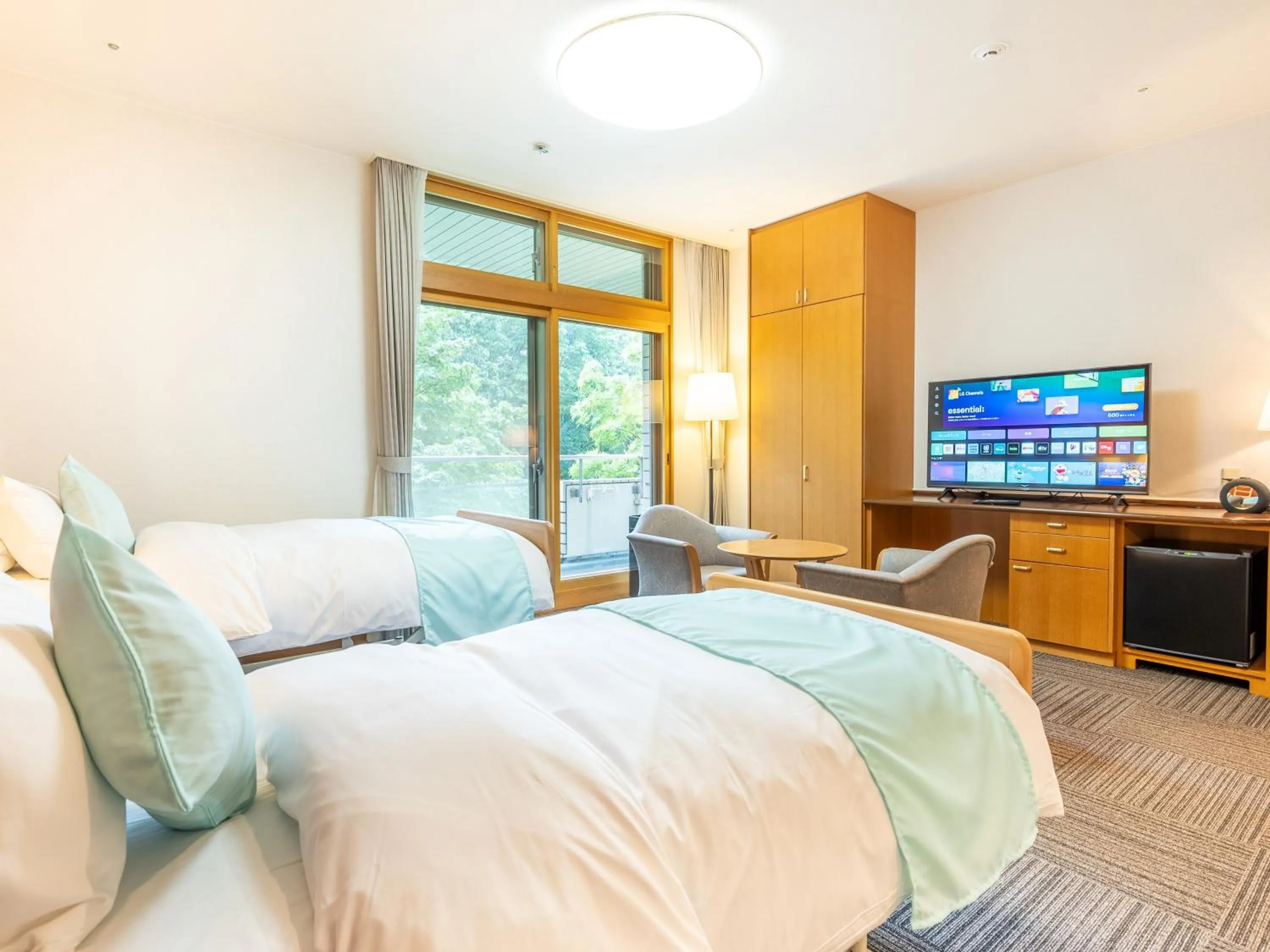 Bed in LiVEMAX Resort Upopoi Shiraoi Onsen