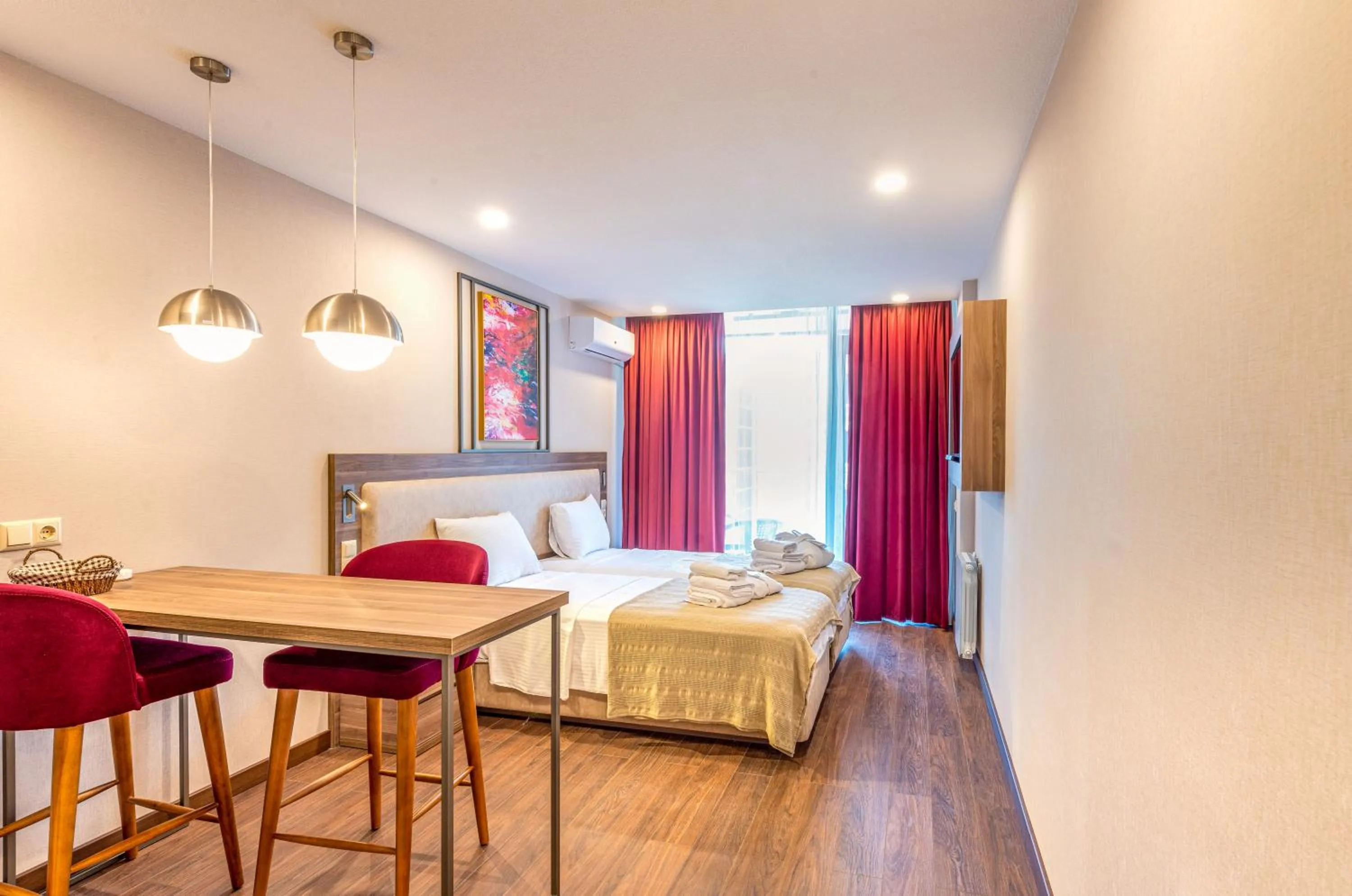 Seating area, Bed in Sunshine Residence & Hotel