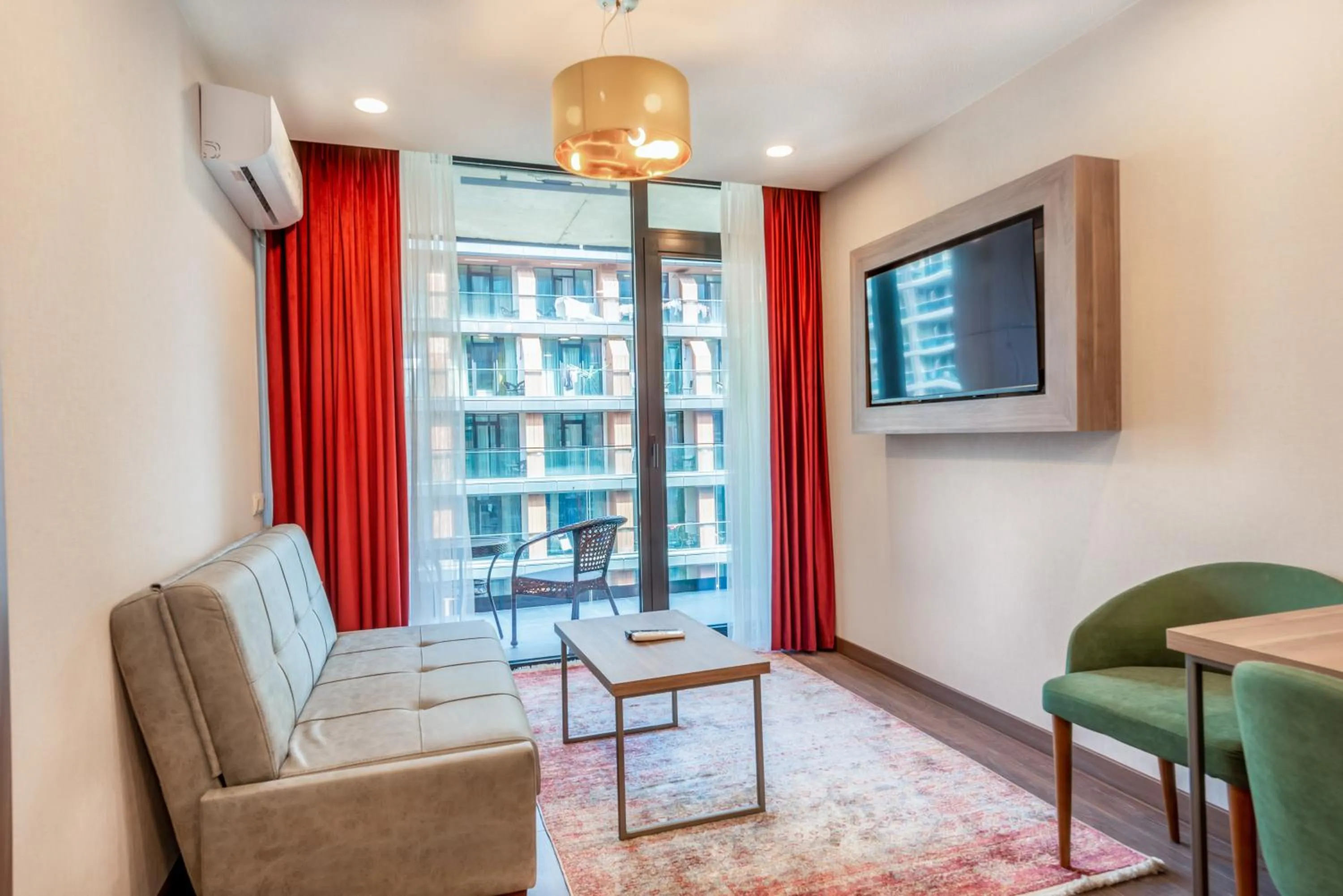 Communal lounge/ TV room in Sunshine Residence & Hotel