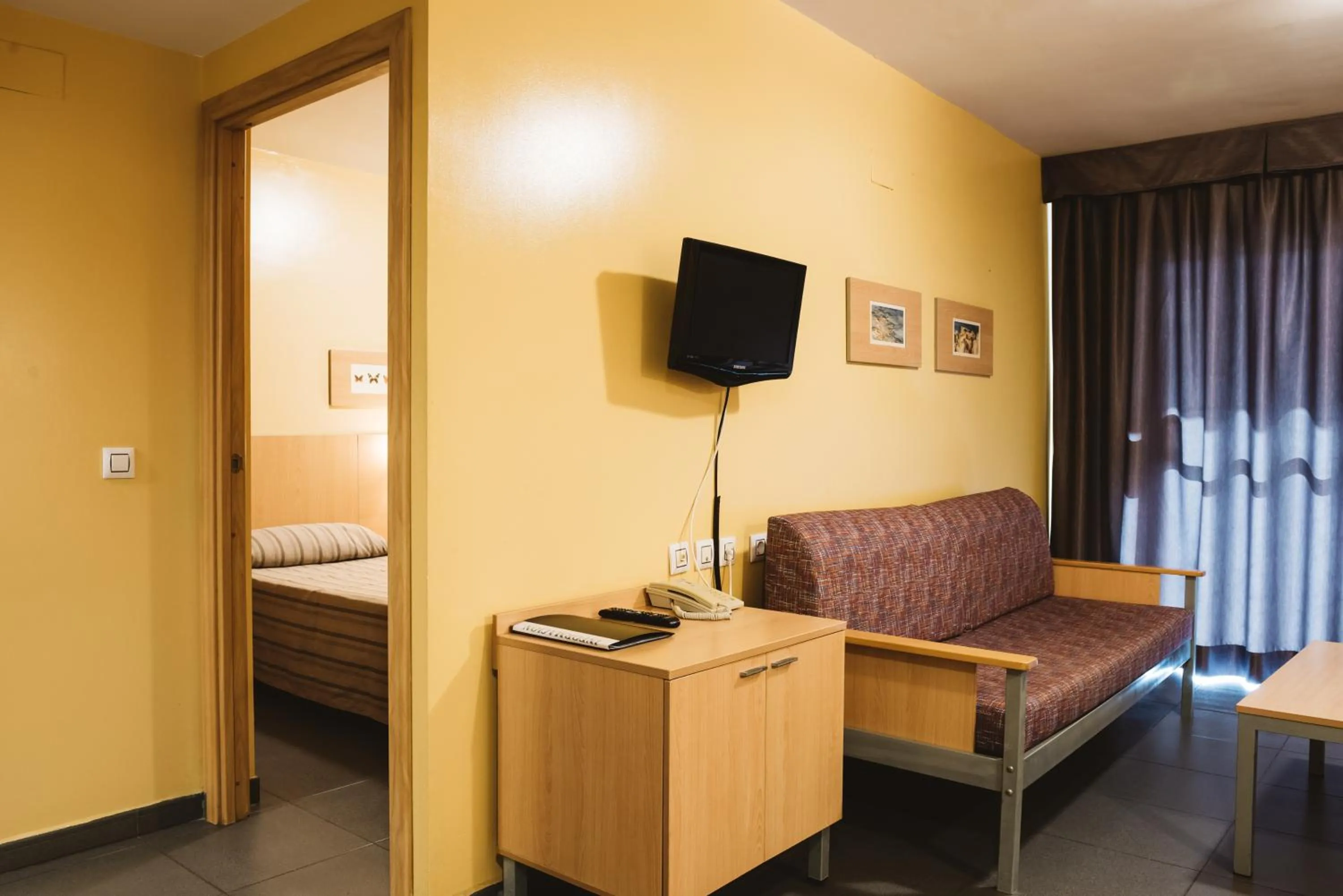 Living room, Bed in Apartamentos Turisticos Terralta