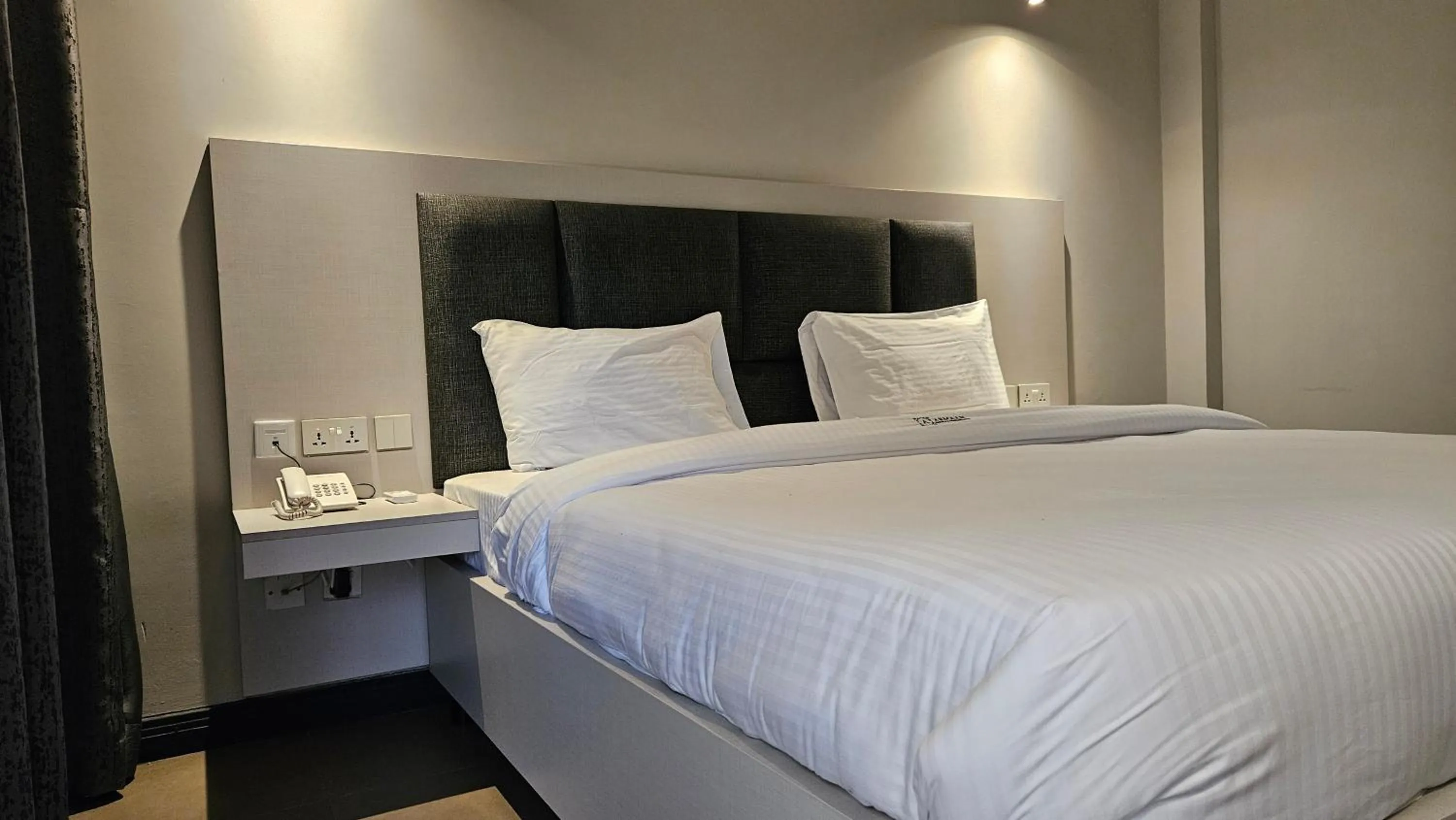 Bed in The Ivory Hotel