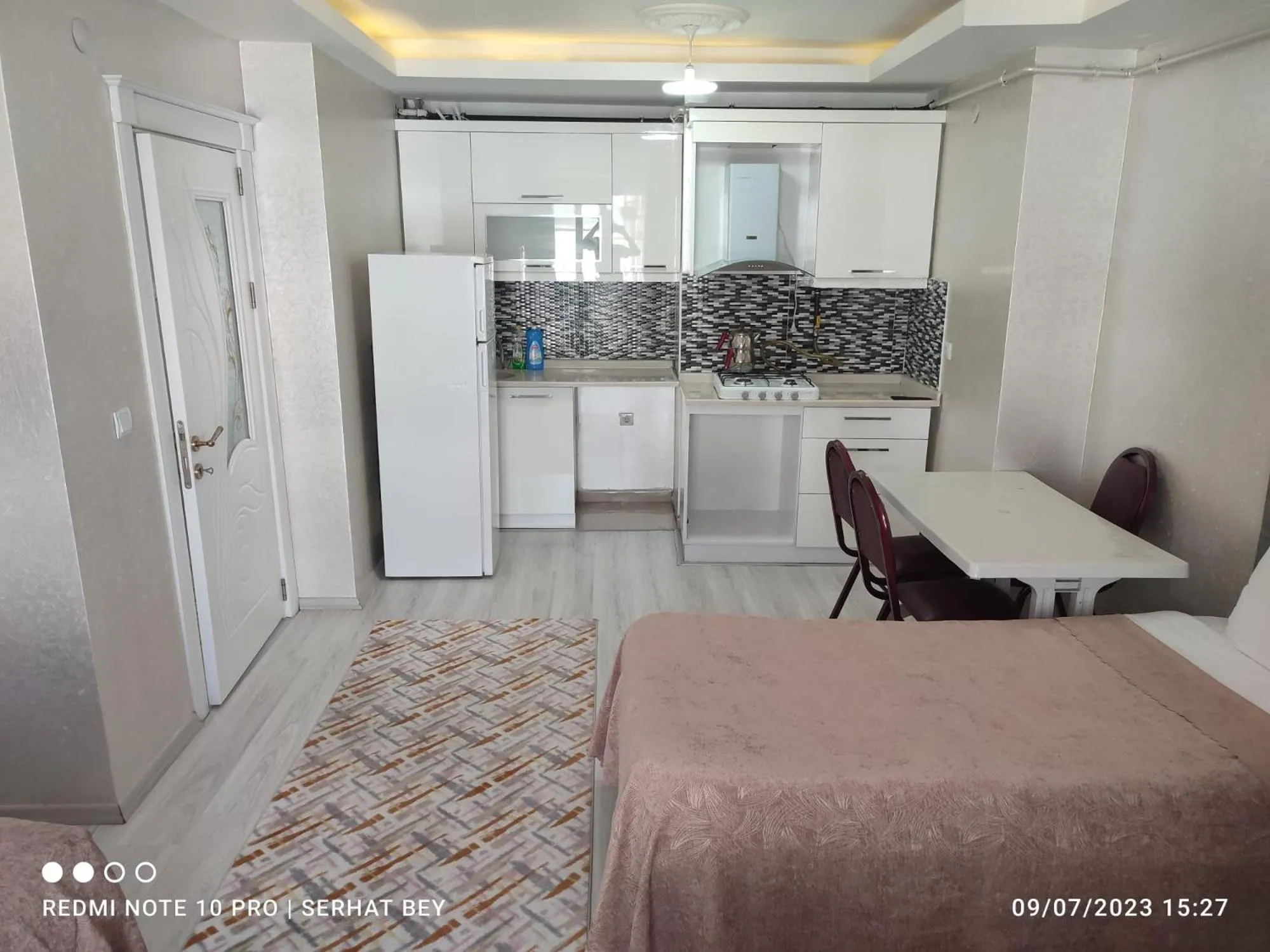 Kitchen or kitchenette, Bed in Espinaz Apart Otel
