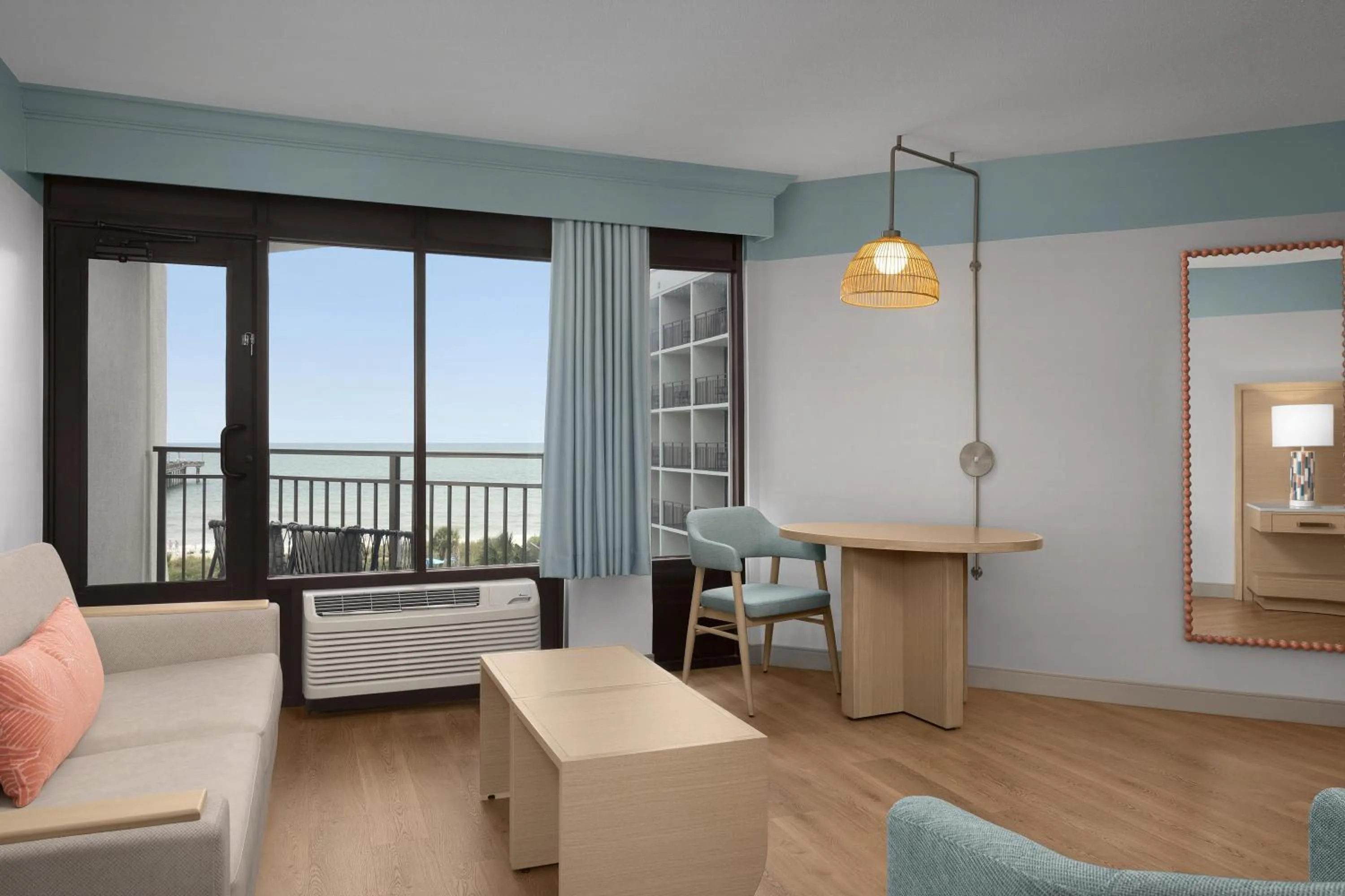 Living room in The Ellie Beach Resort Myrtle Beach, Tapestry By Hilton