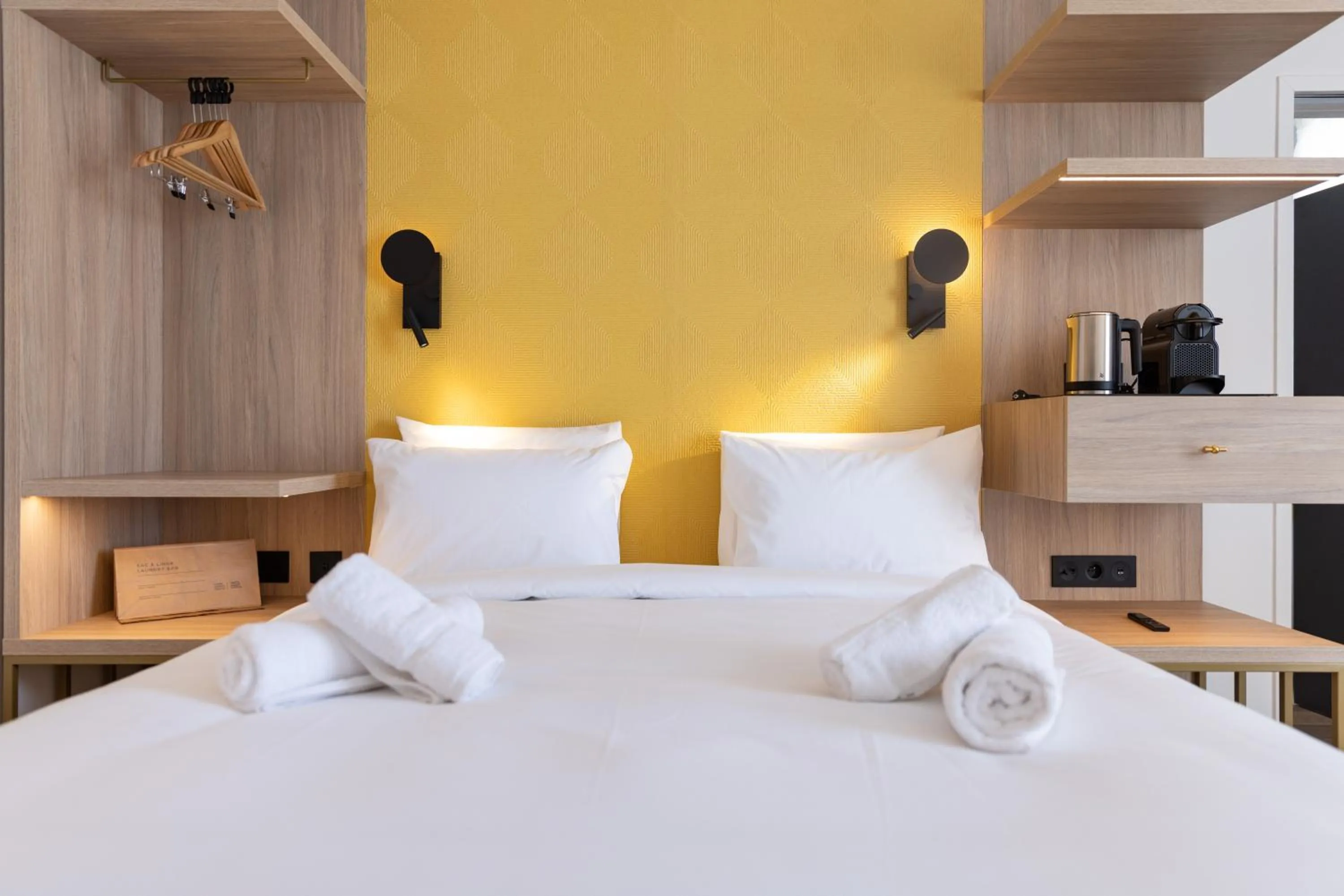 Bed in Hôtel Kyriad Prestige Paris Asnieres