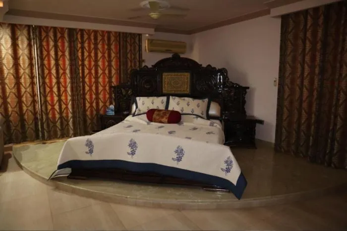 Bed in PRITHVI FARM COTTAGE AND VILLA