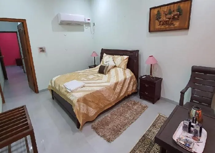 Bed in PRITHVI FARM COTTAGE AND VILLA