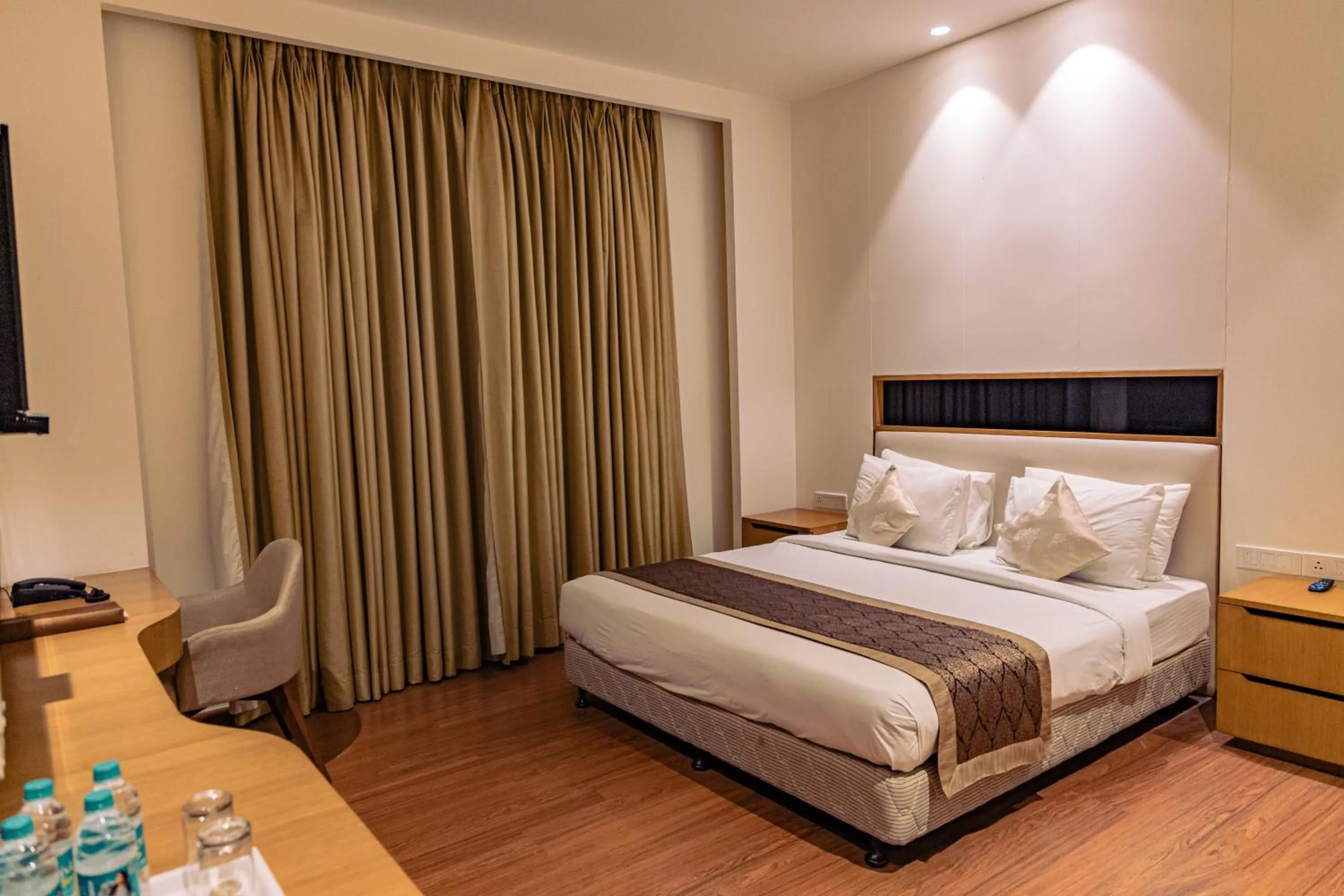 Bed in The Nikunj Hotels