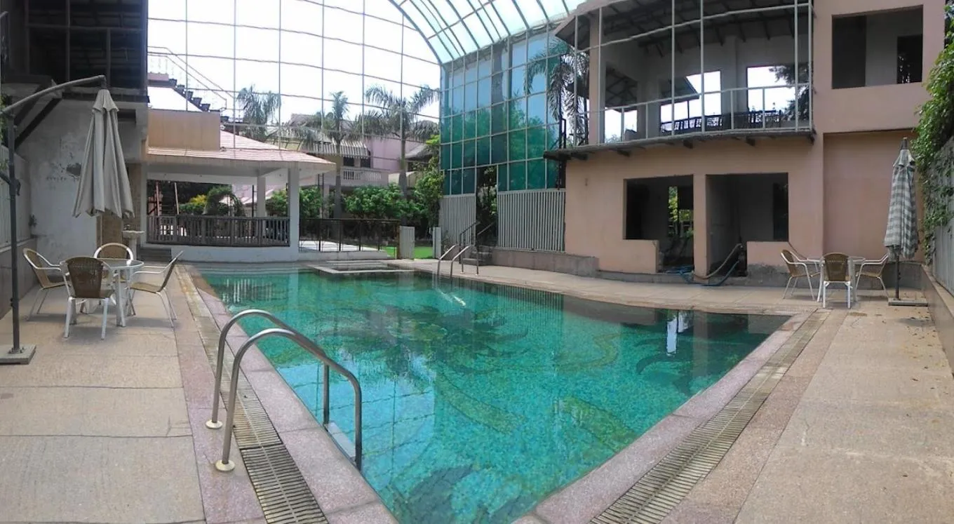 Swimming pool in The Nikunj Hotels