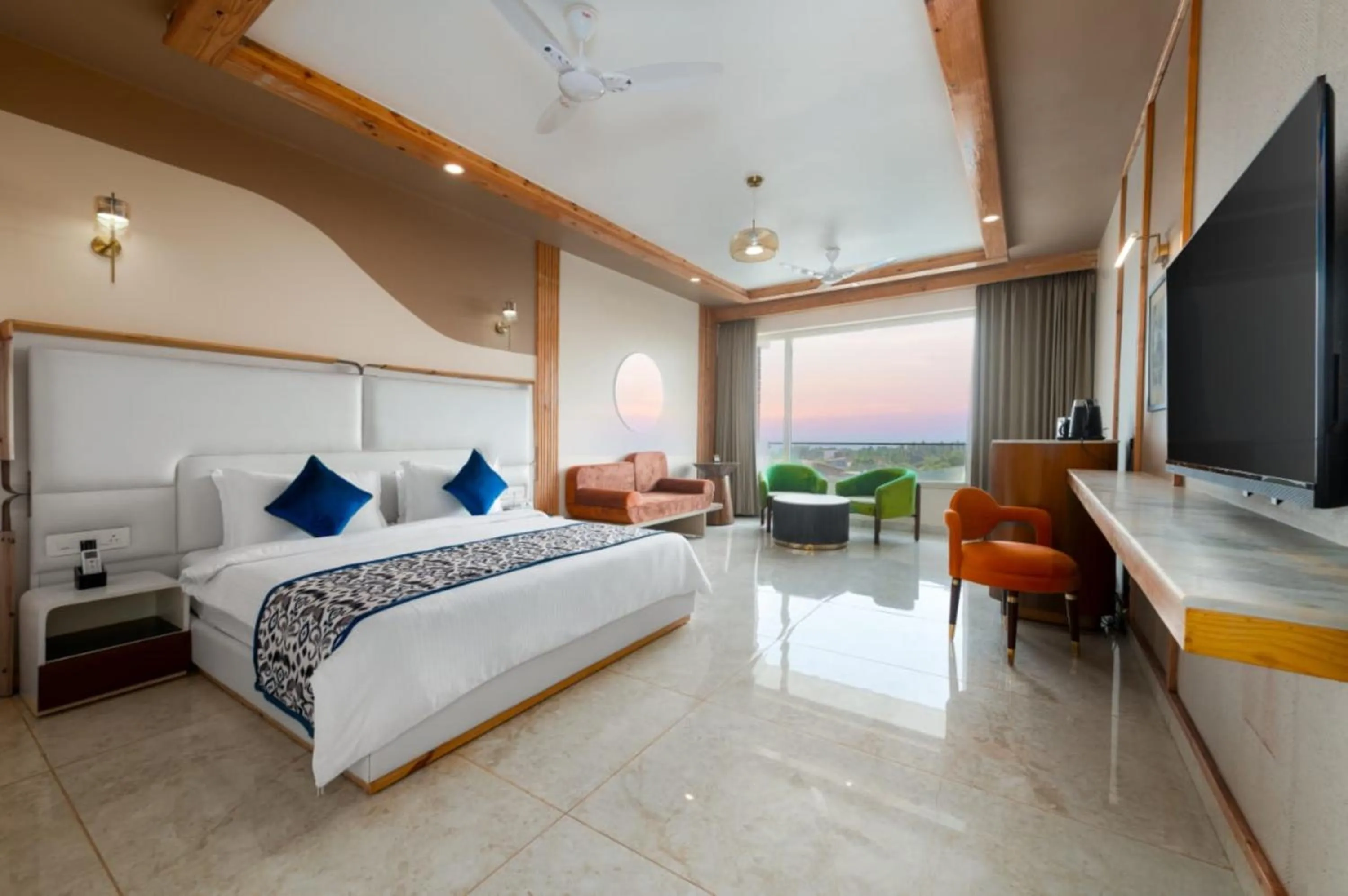 Seating area, Bed in Grand Continent Morjim