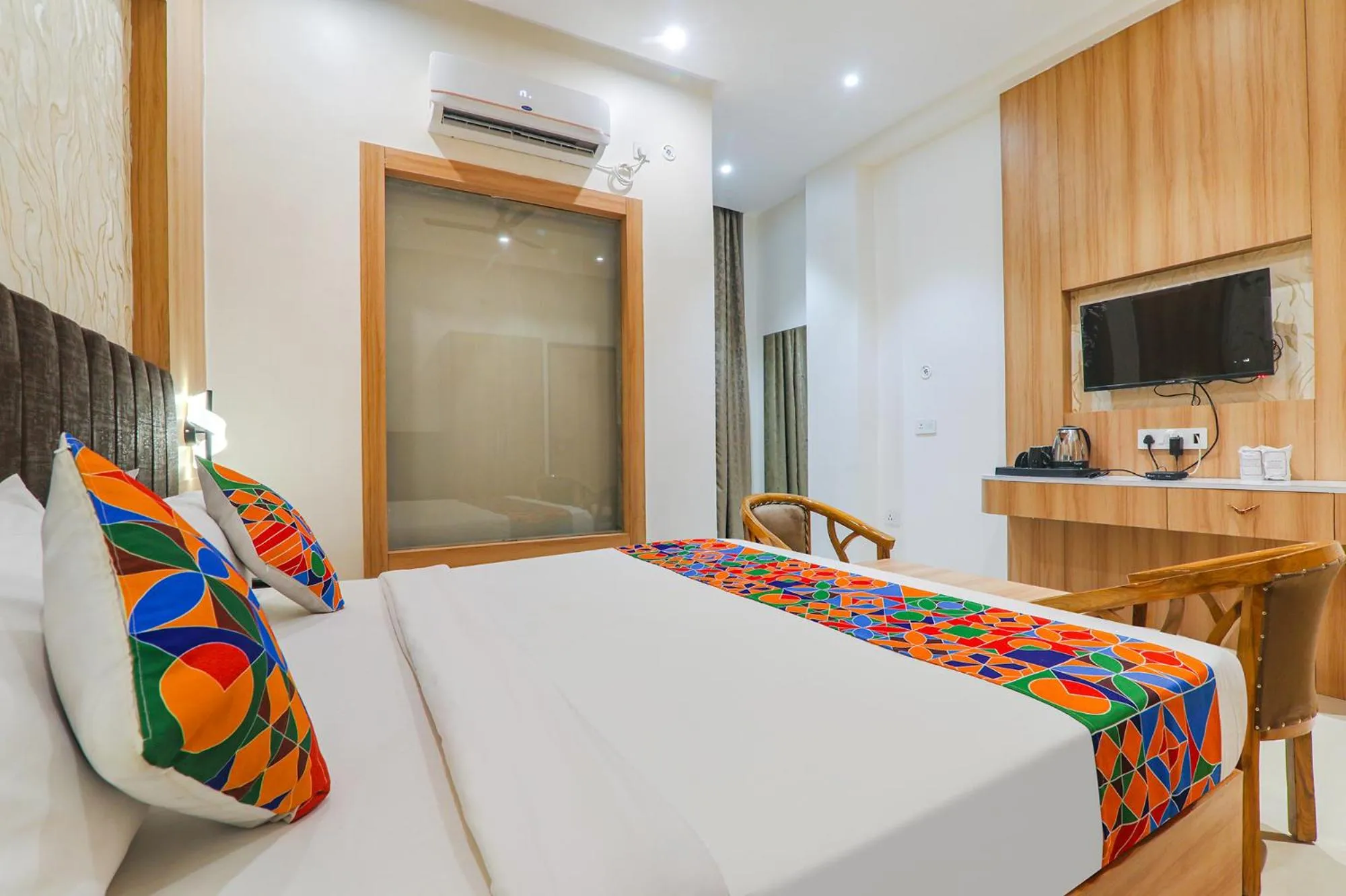 Bed in FabHotel Raj Palace