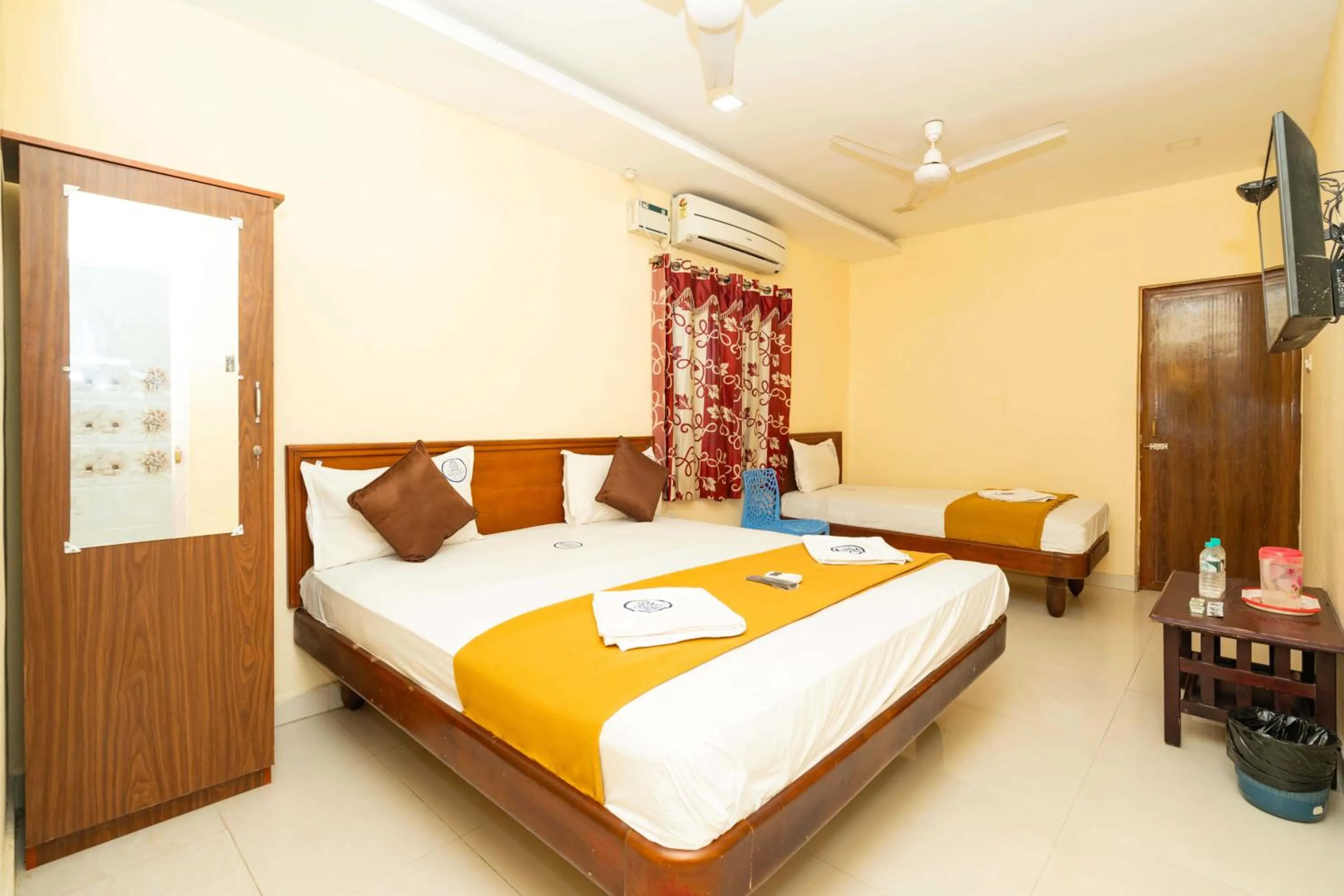Photo of the whole room, Bed in Amman Residency - Rameswaram