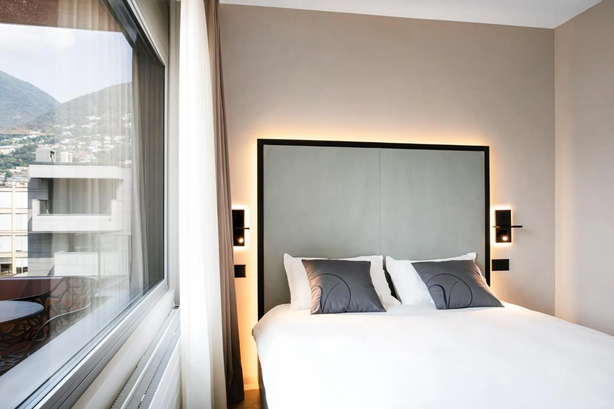 Bed in VISIONAPARTMENTS Lugano - contactless check-in
