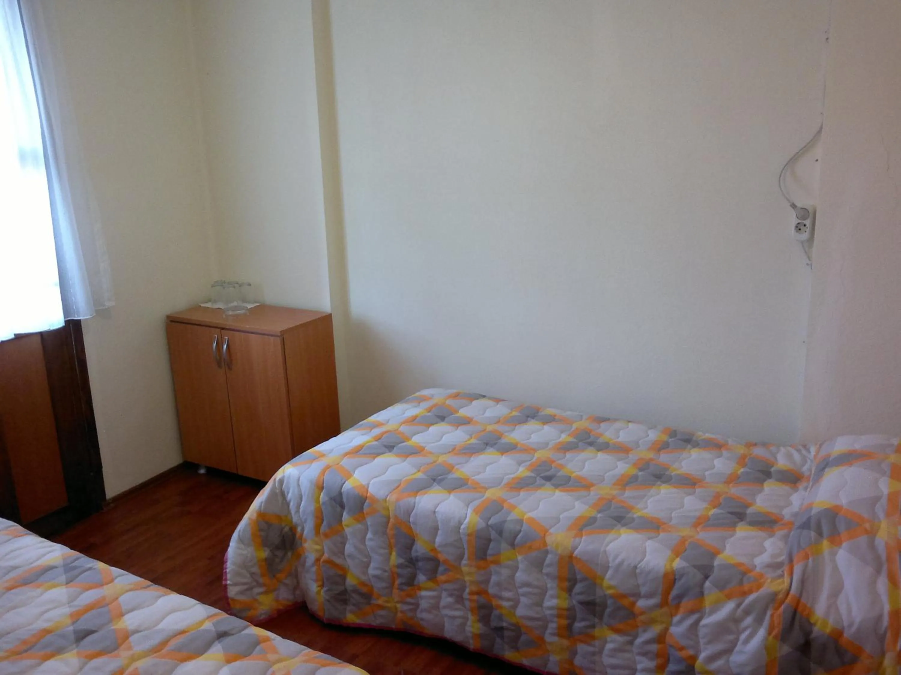 Bed in Kalanora Resort Hotel