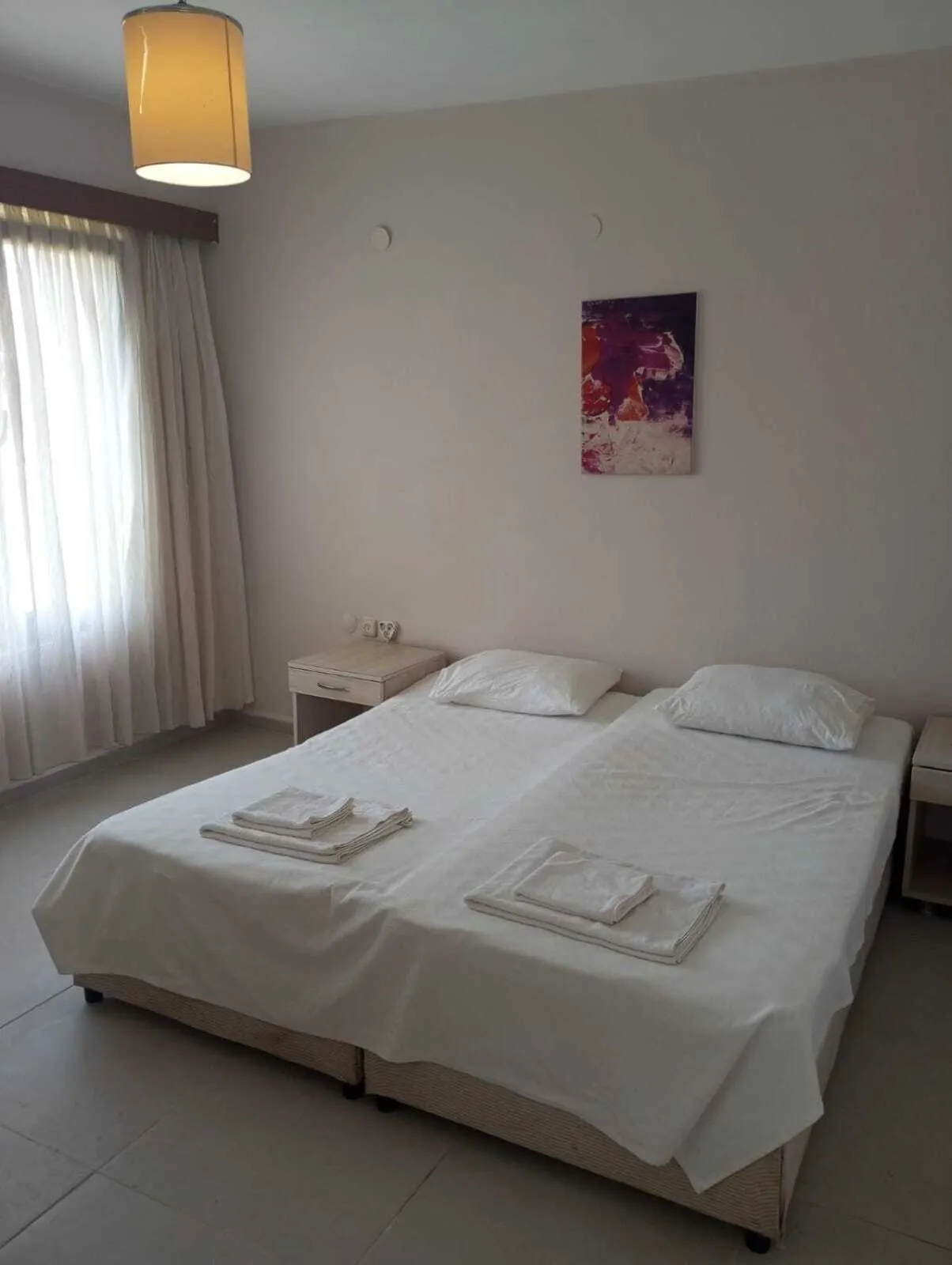 Bed in Kalanora Resort Hotel