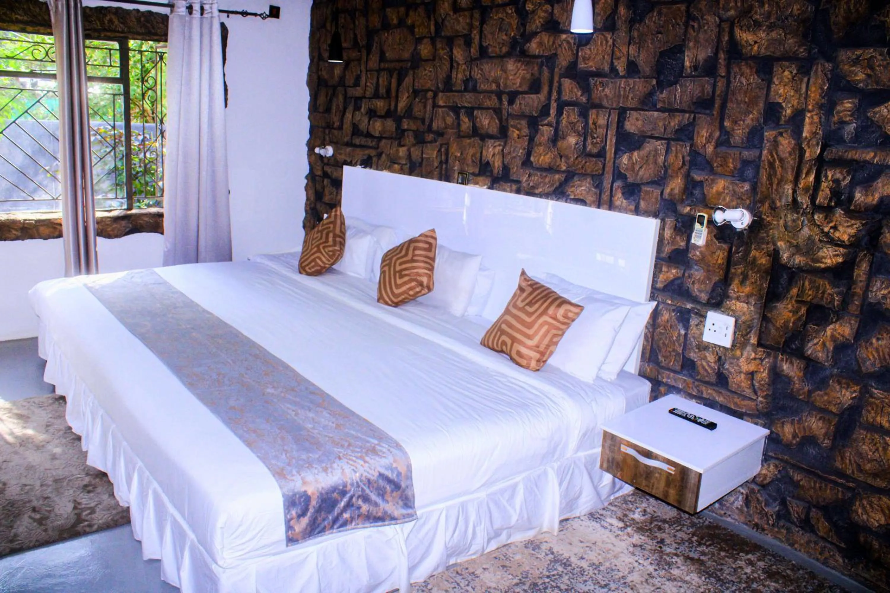 Bed in Rustiek Hotel