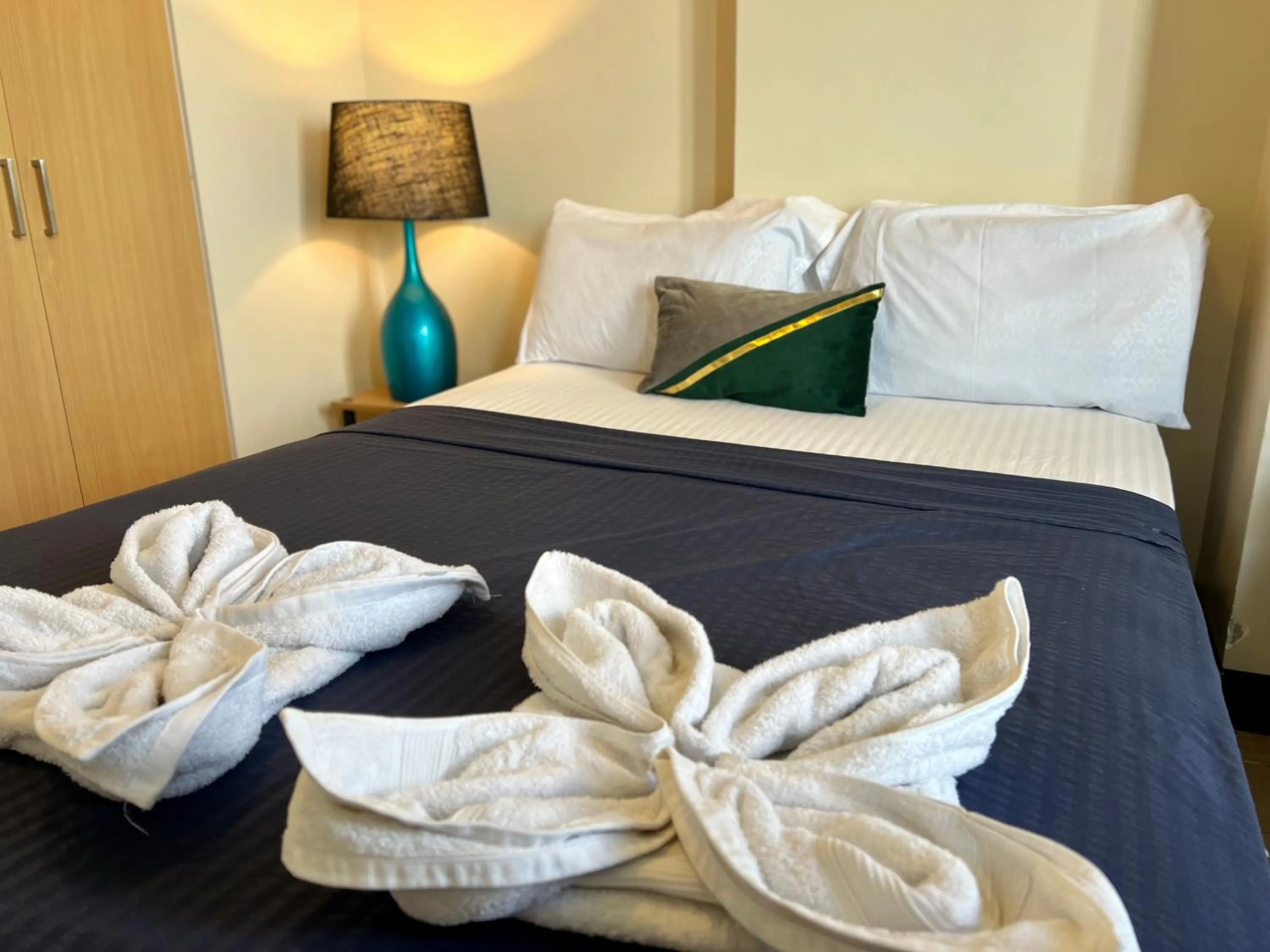 Bed in Mactan Newtown A by Isla Stays