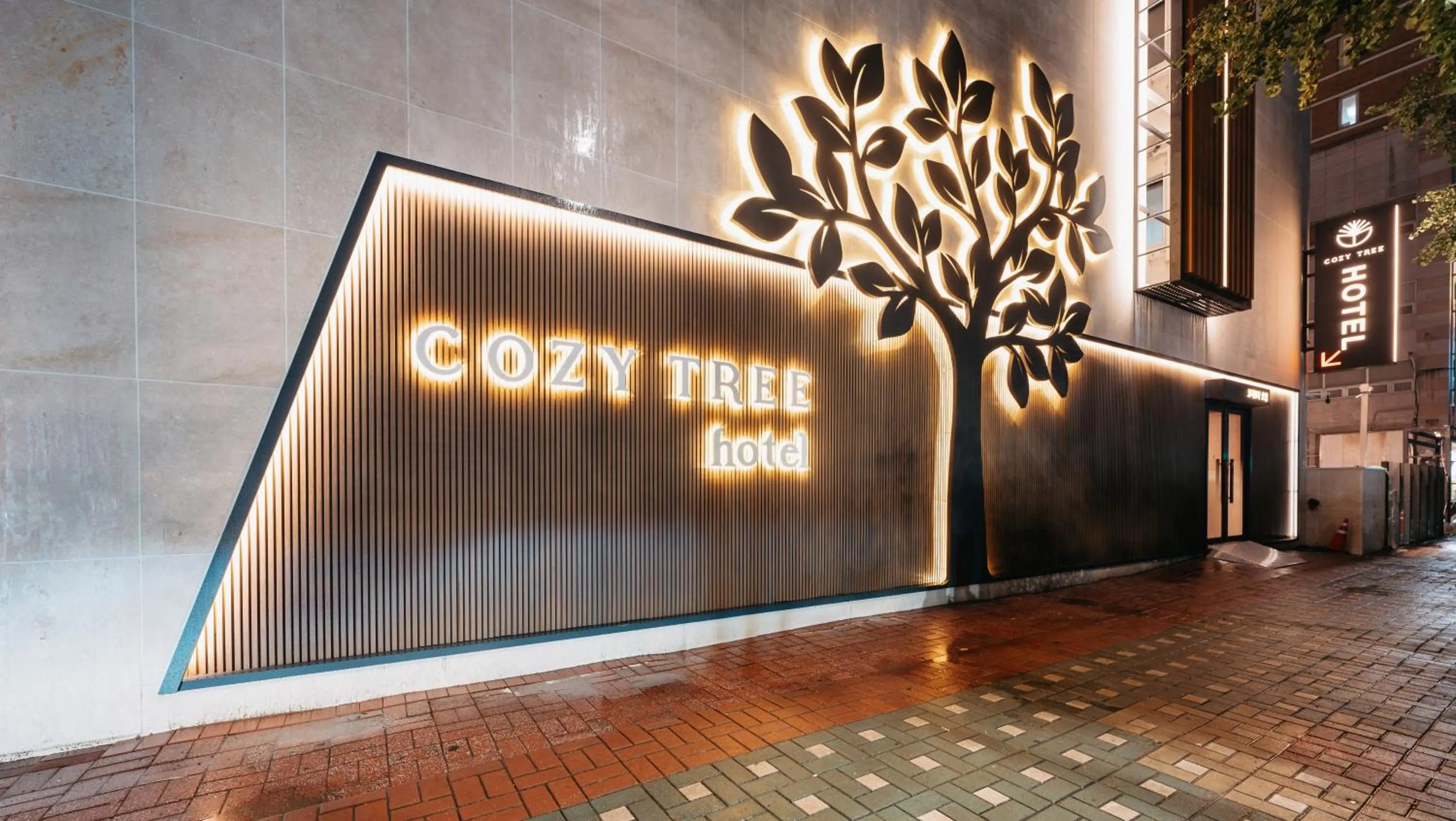 Property logo or sign in Cozy Tree Hotel Seomyeon