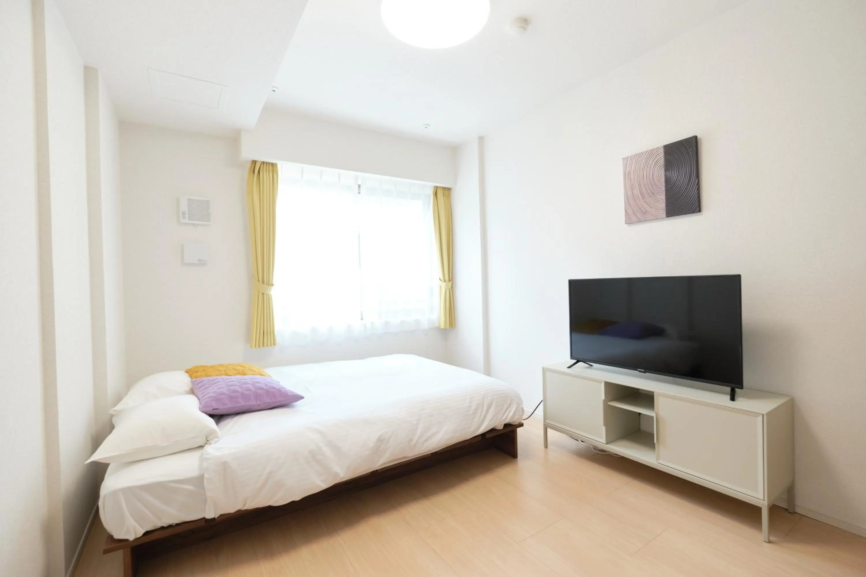 Bed in J-ARC Akebonobashi by Tranova