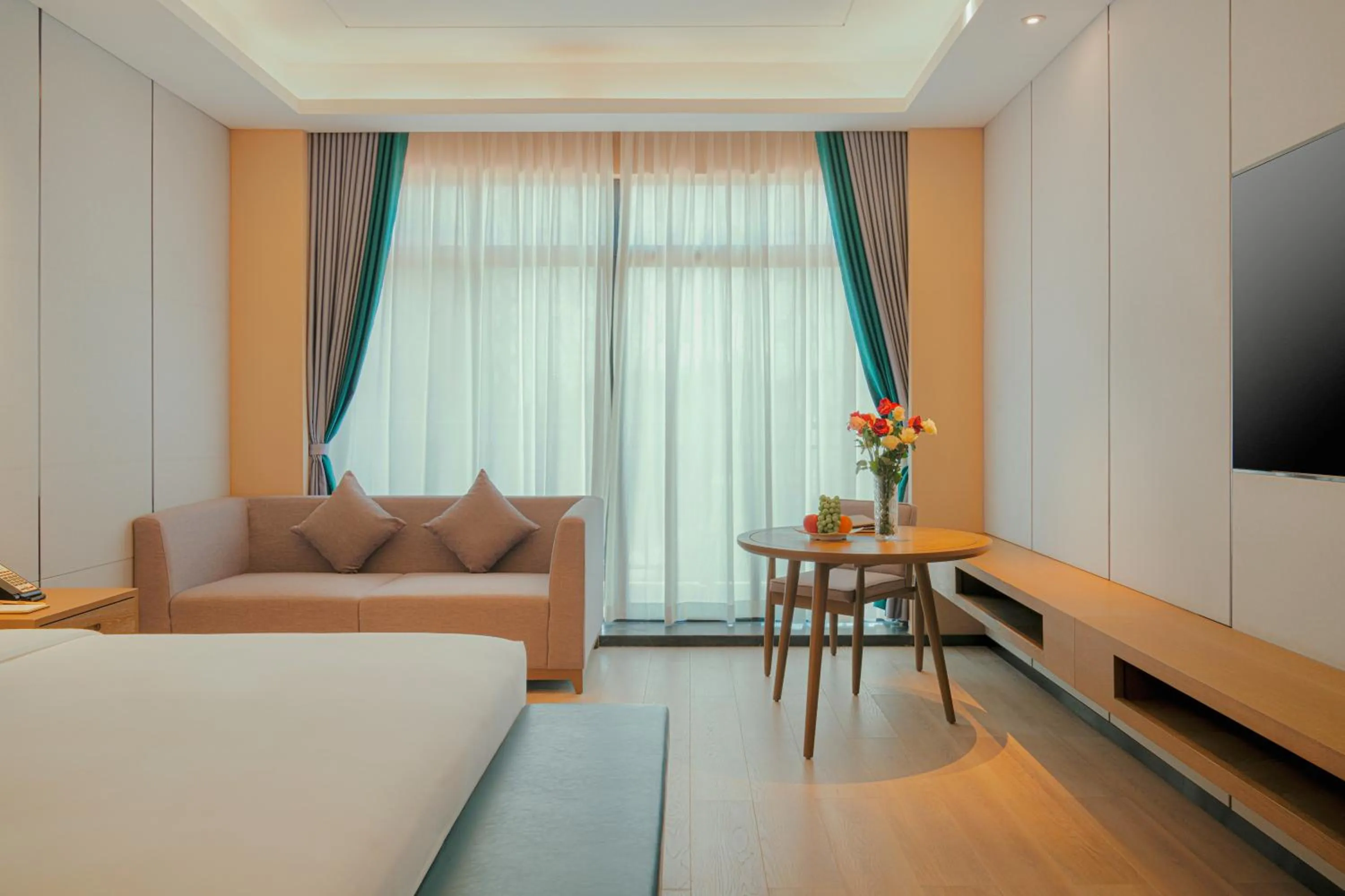 Living room, Bed in DongHu Resort Hotel