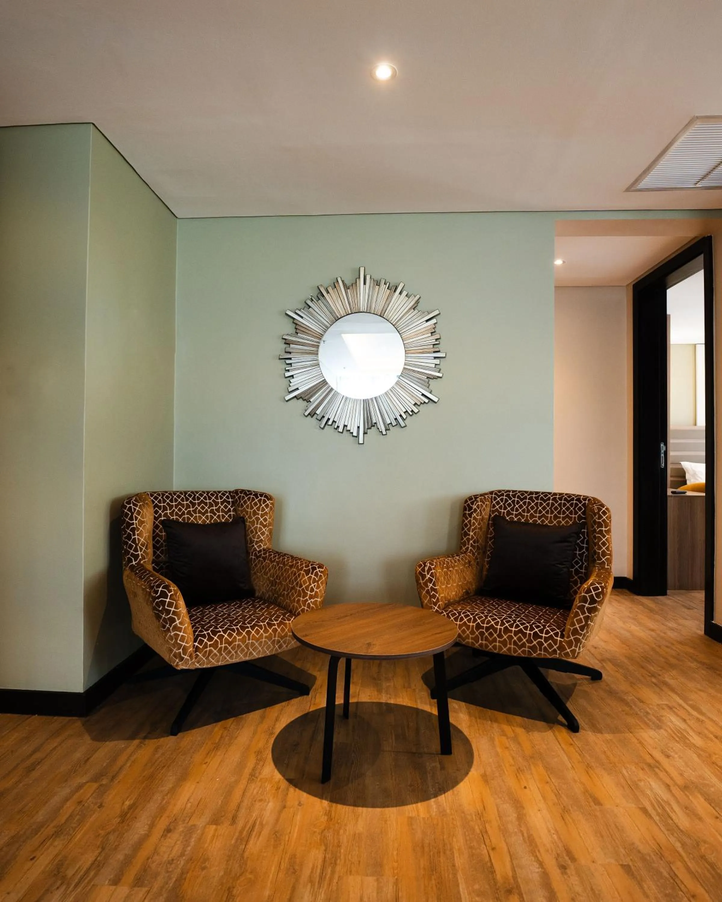 Living room in Trademark Suites at Enaki Town