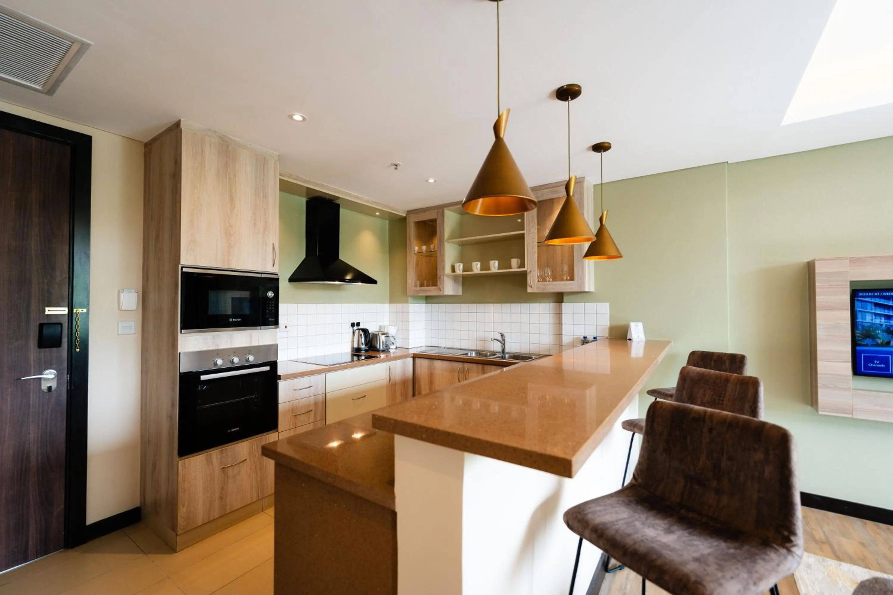 kitchen in Trademark Suites at Enaki Town