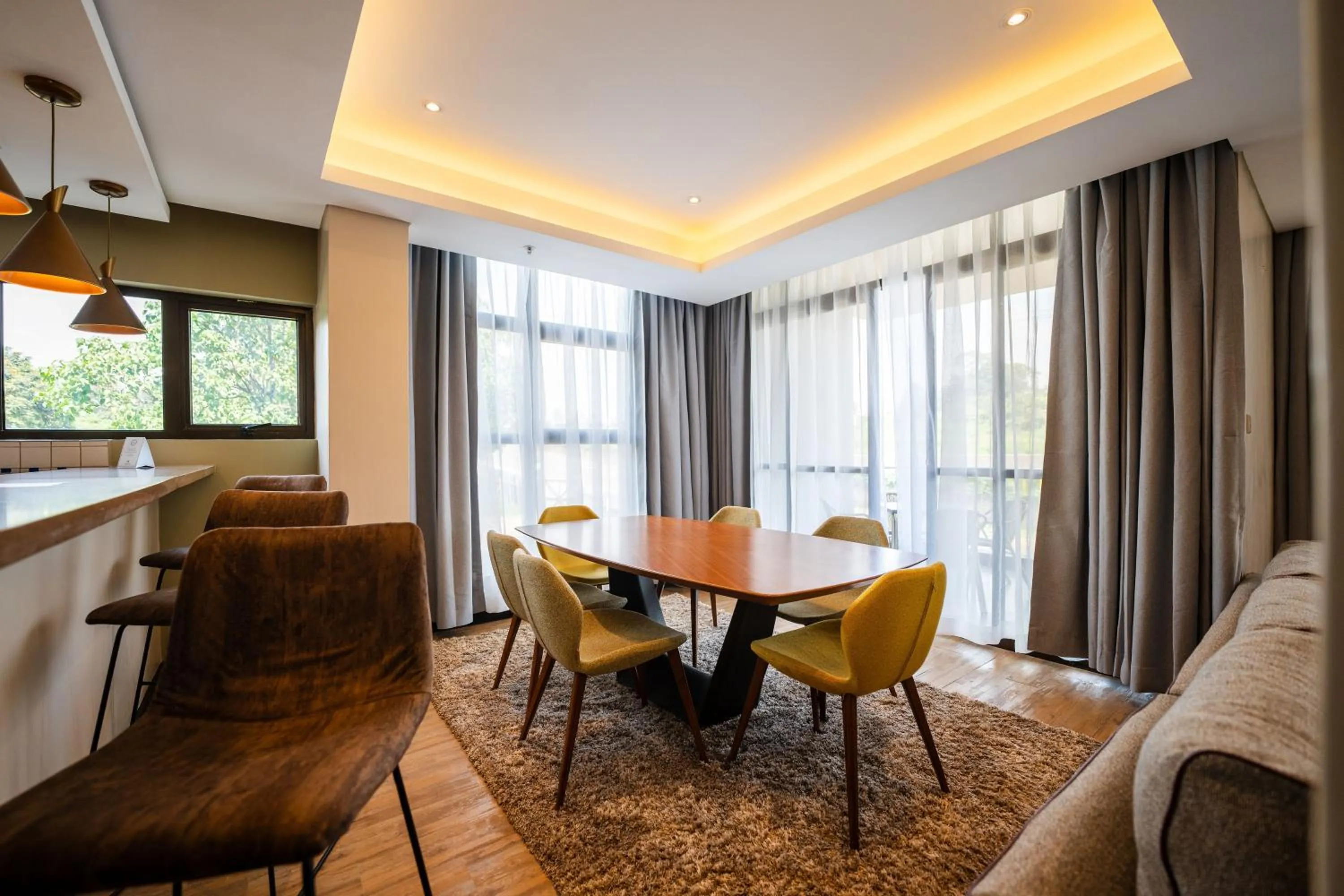 Dining area in Trademark Suites at Enaki Town