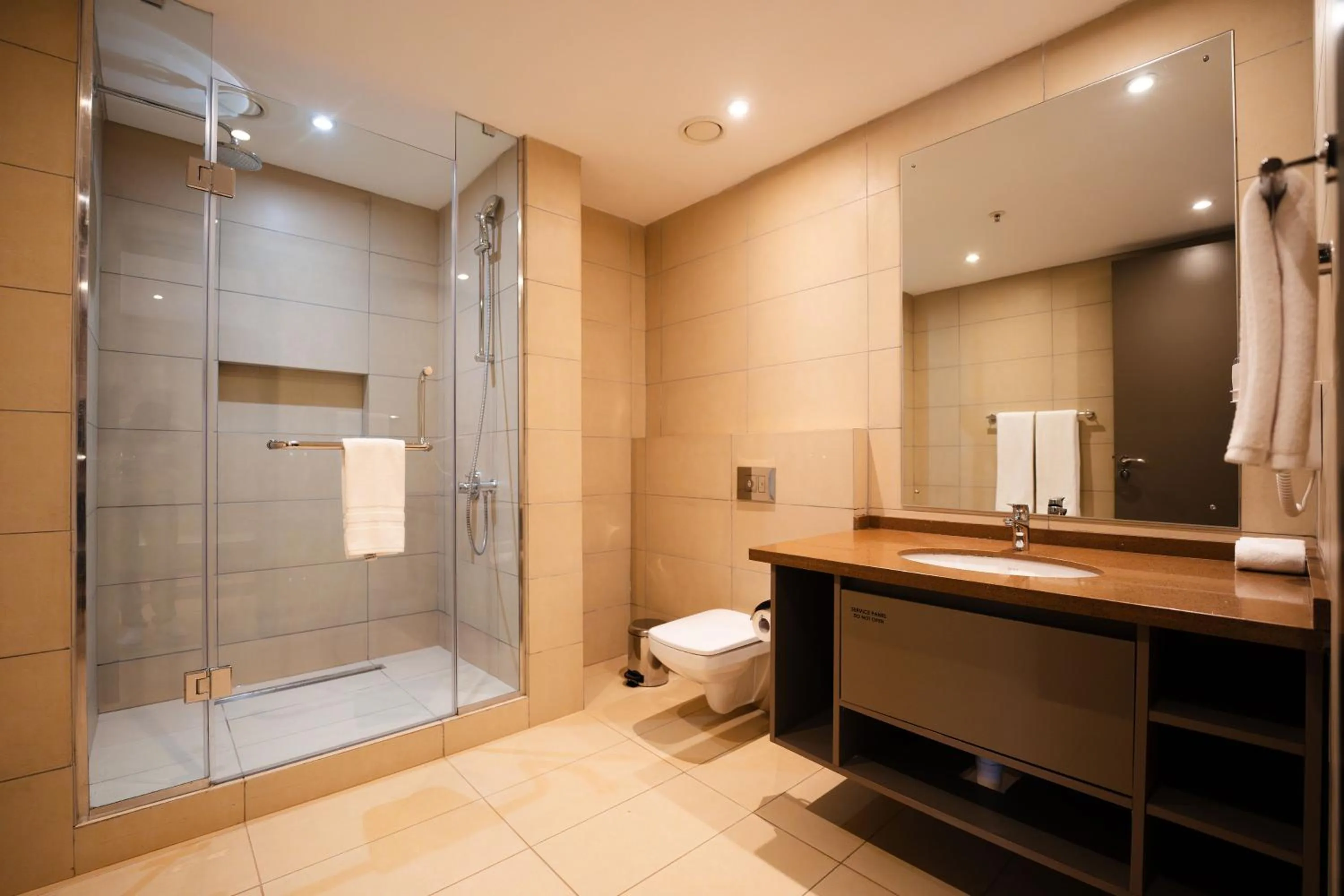 Bathroom in Trademark Suites at Enaki Town