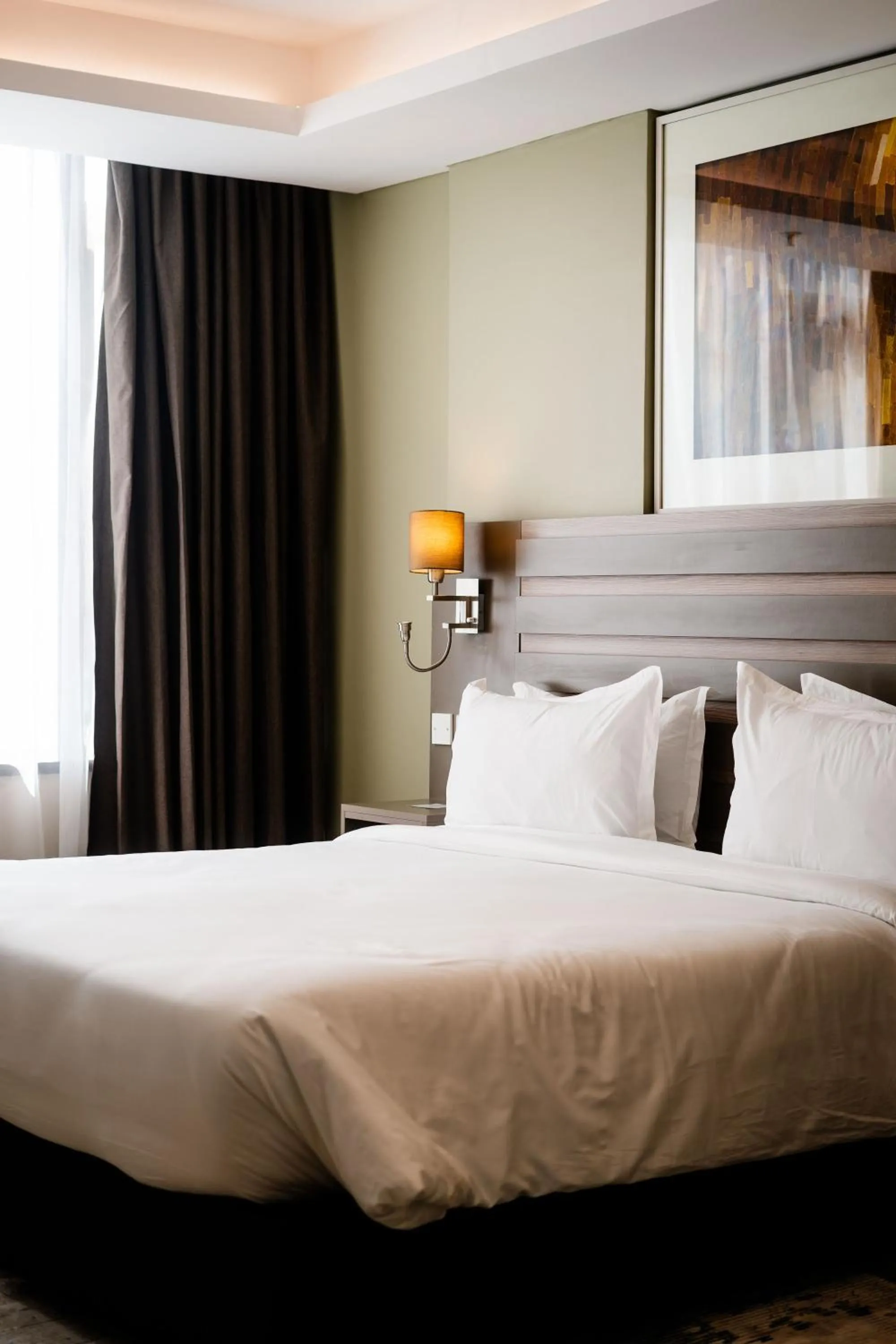 Bedroom, Bed in Trademark Suites at Enaki Town