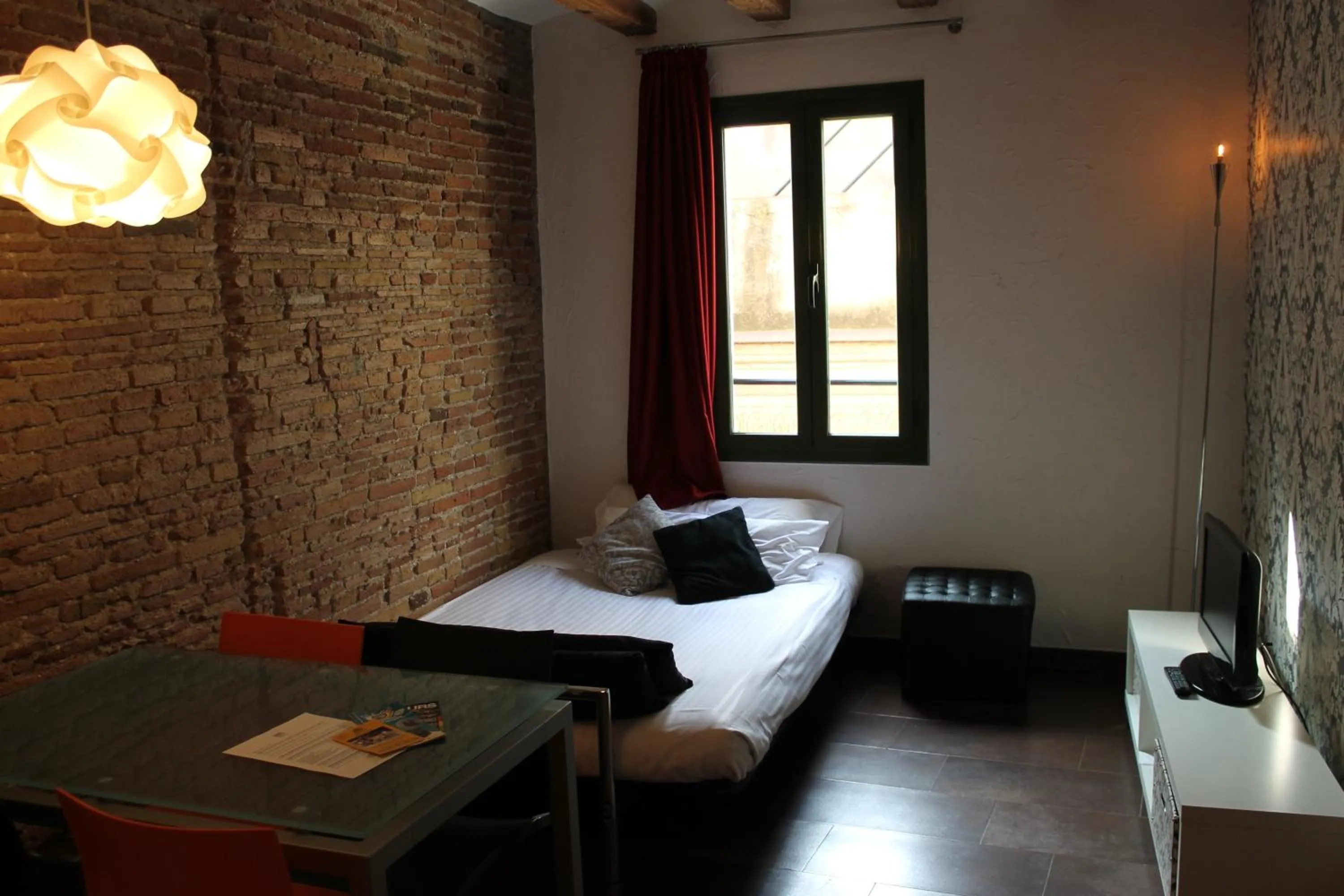 Living room, Bed in Apartaments Ciutat Vella