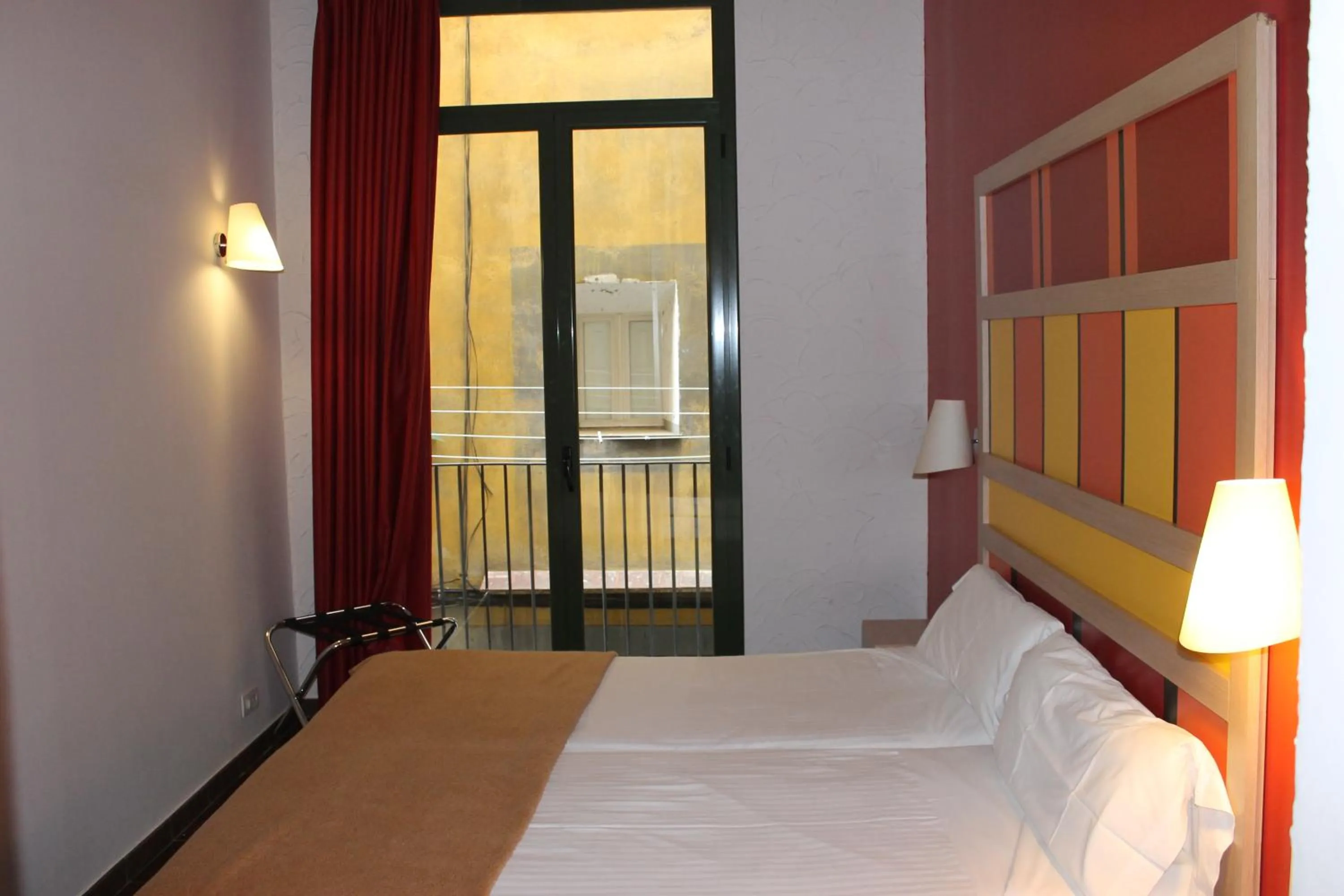 Bedroom, Bed in Apartaments Ciutat Vella