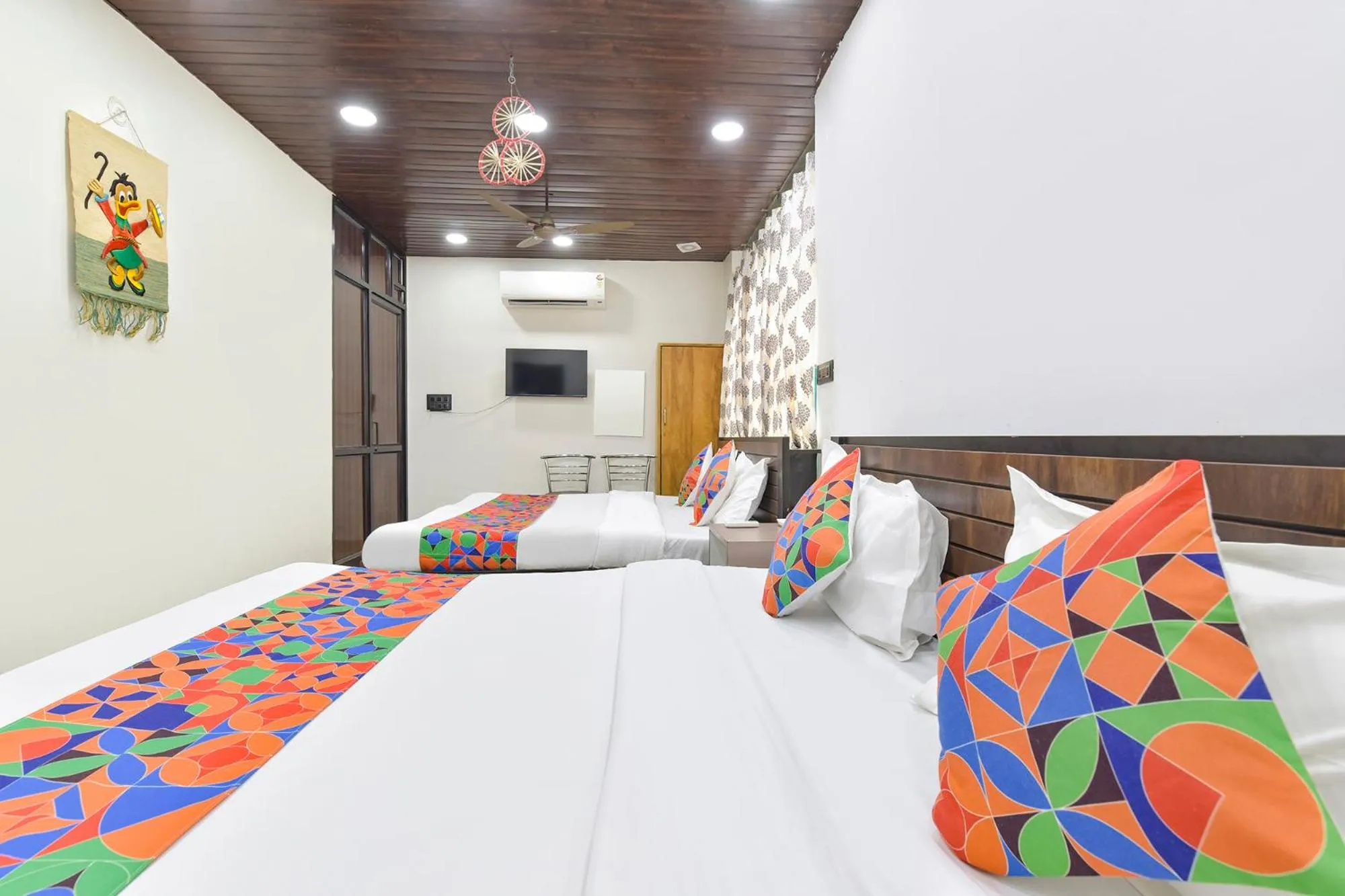 Bed in FabHotel Govindam Royal Stay