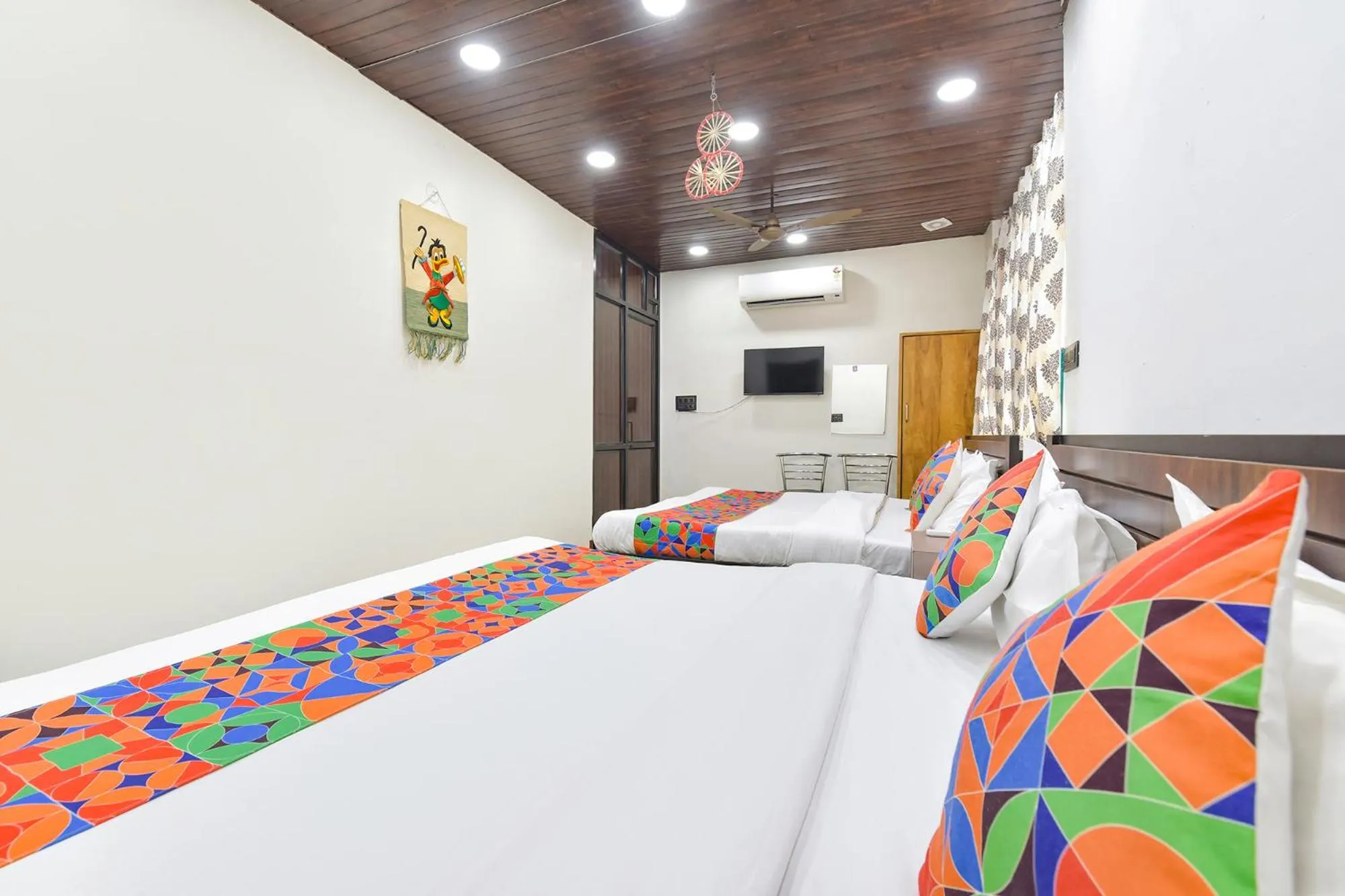Bed in FabHotel Govindam Royal Stay