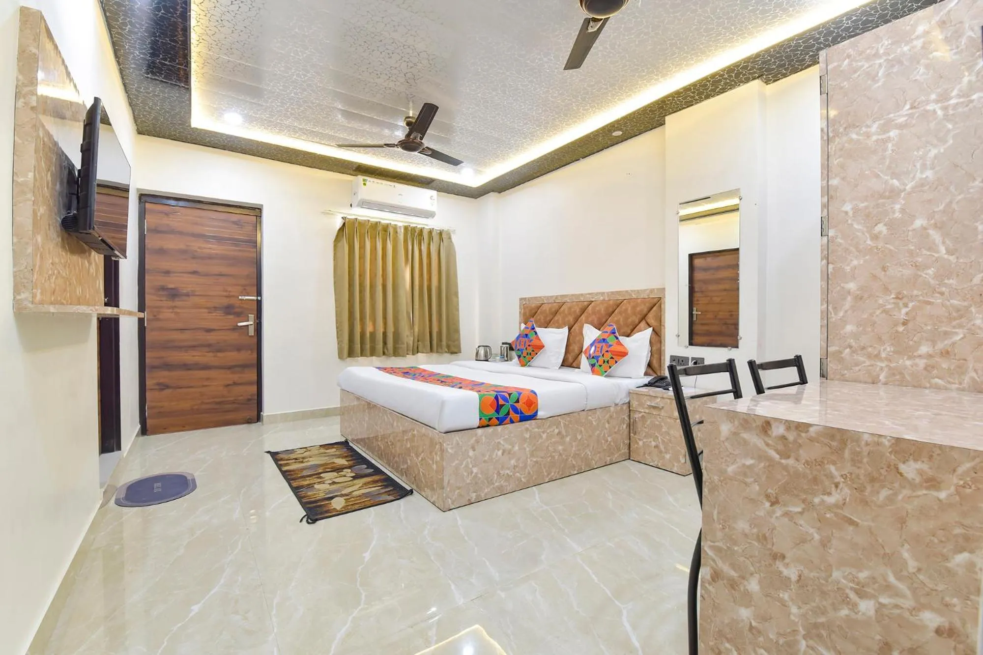 Bed in FabHotel Govindam Royal Stay